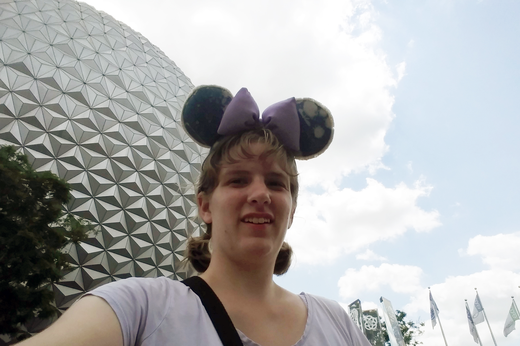 Cassandra Swiecicki standing outside at Disney, smiling