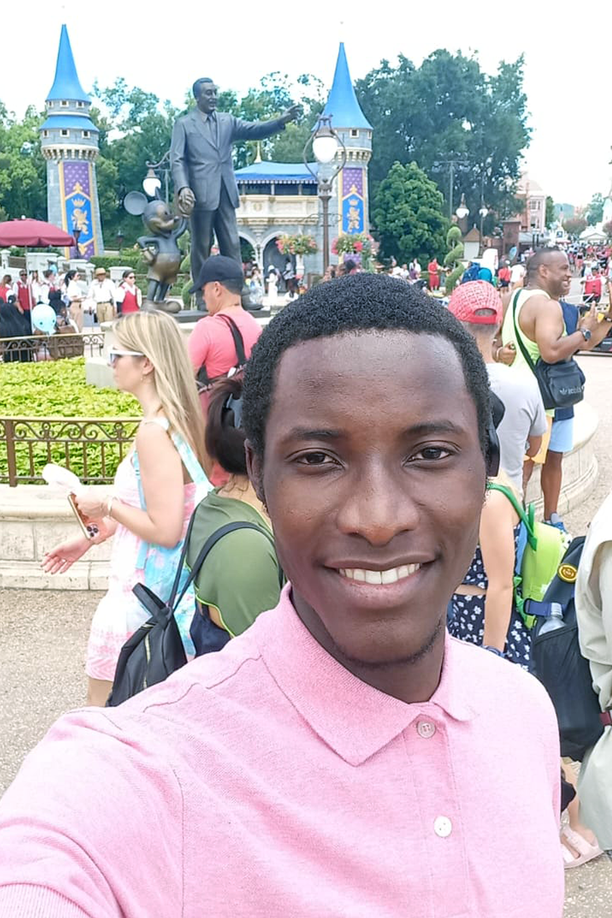 Ngambela Zulu standing outside at Disney, smiling