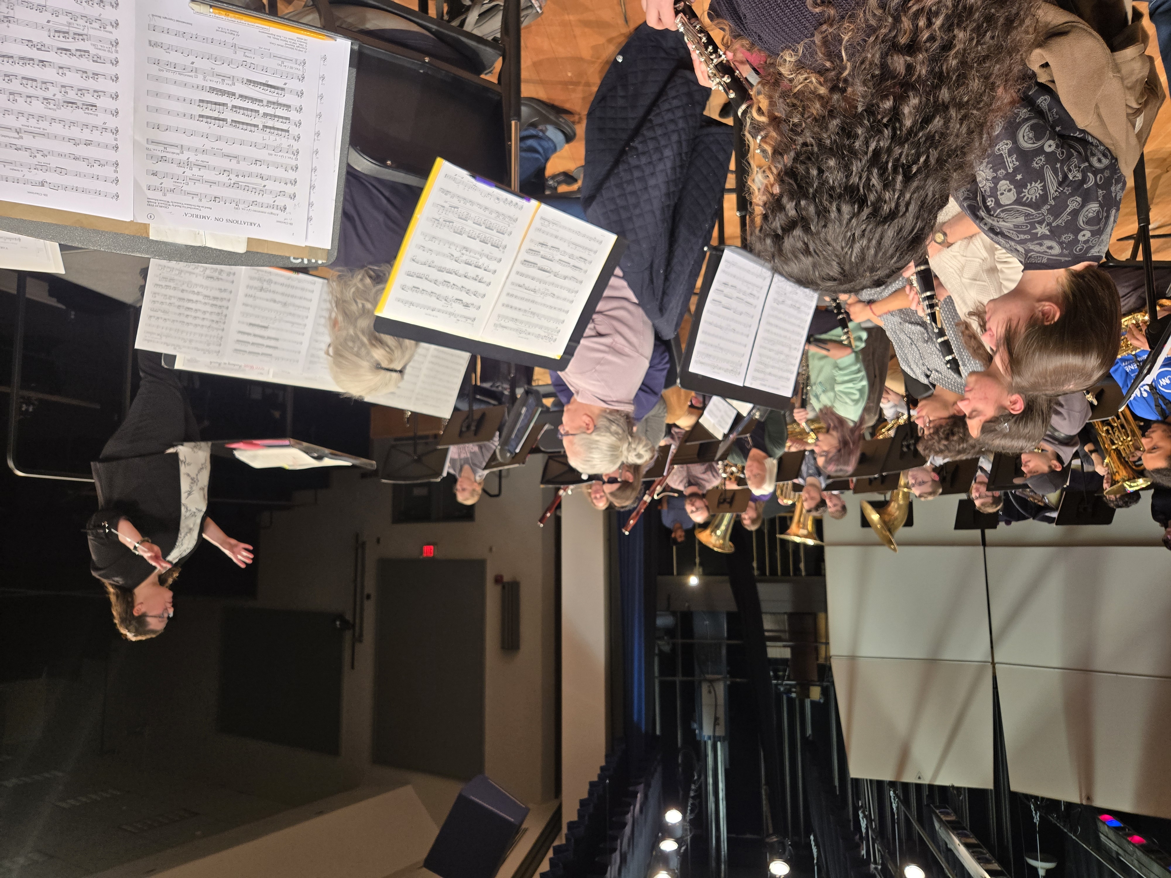 Dr. Allyson Keyser directing the Wind Ensemble on stag. 