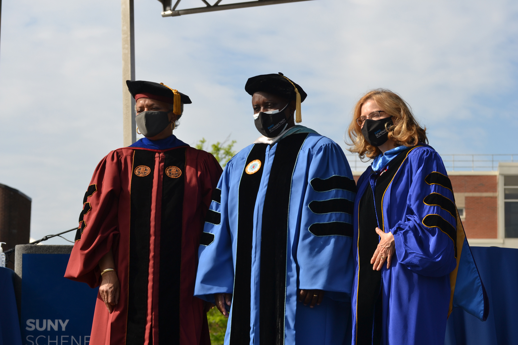 Dr. Gooch, Dr. Moono, and Ann Fleming Brown on stage