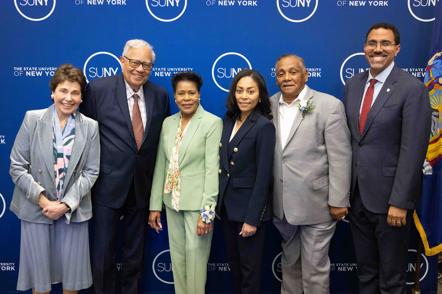 Dr. Nicole Reaves, her parents, SUNY Chancellor King, and SUNY Trustees Tisch and Perales