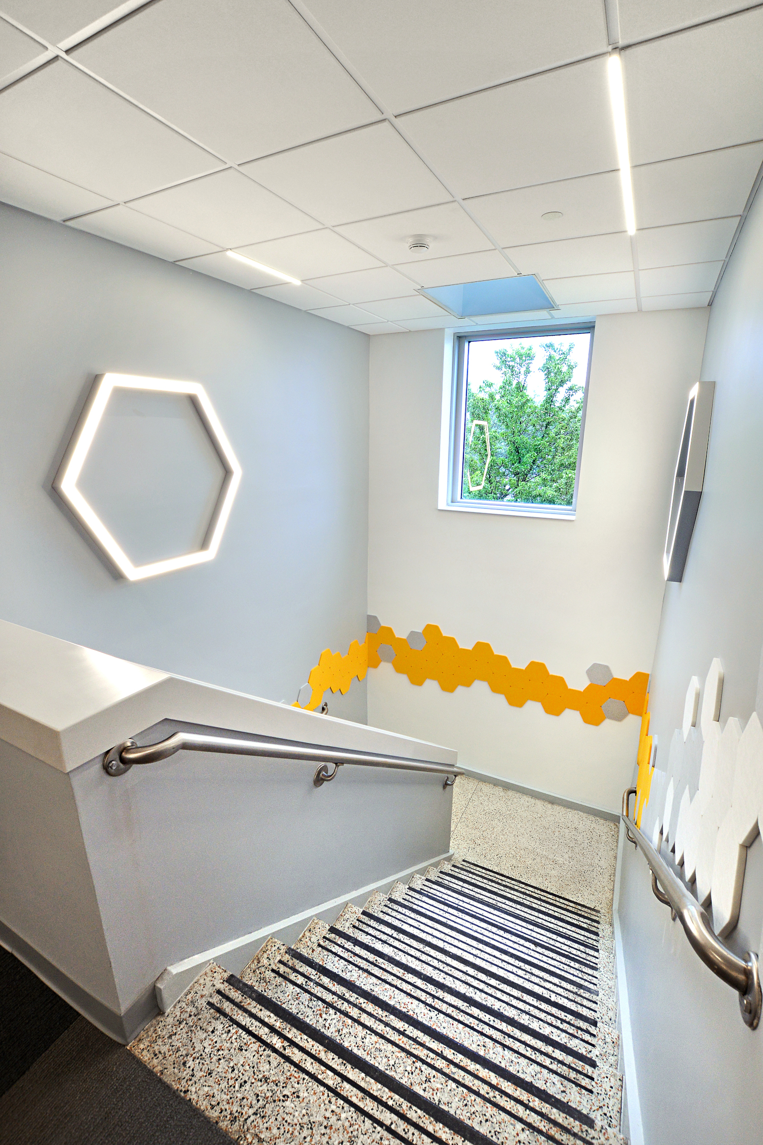 Stairway in new Learning Commons with artwork