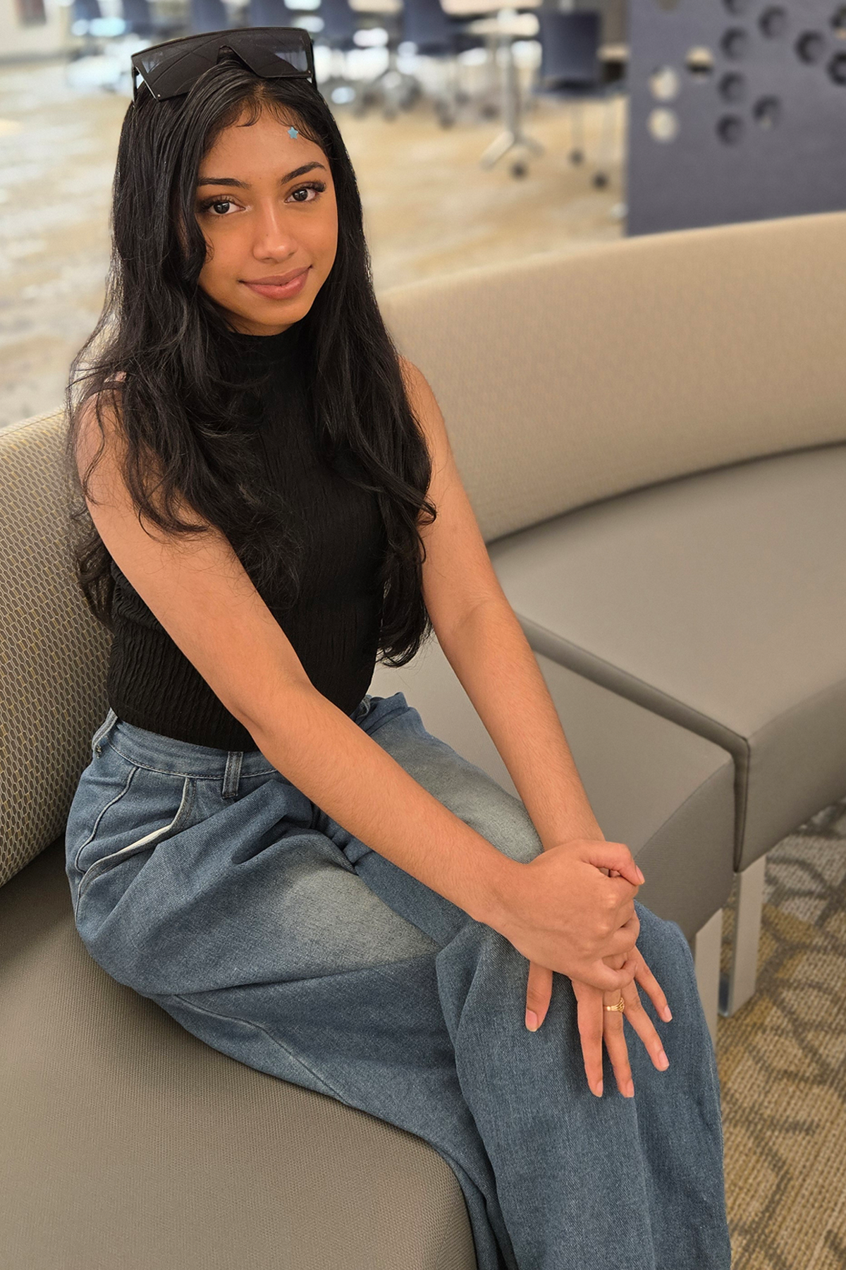 Hema Singh sitting in library