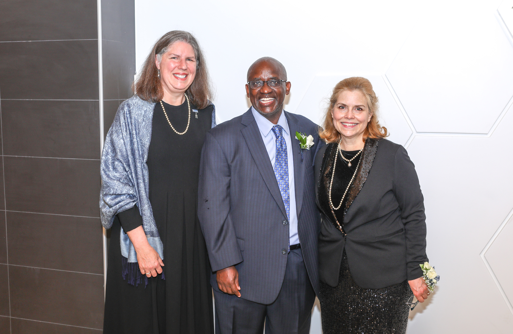 Dr. Moono, Ann Fleming Brown and Lynn Mannnin standing during reception