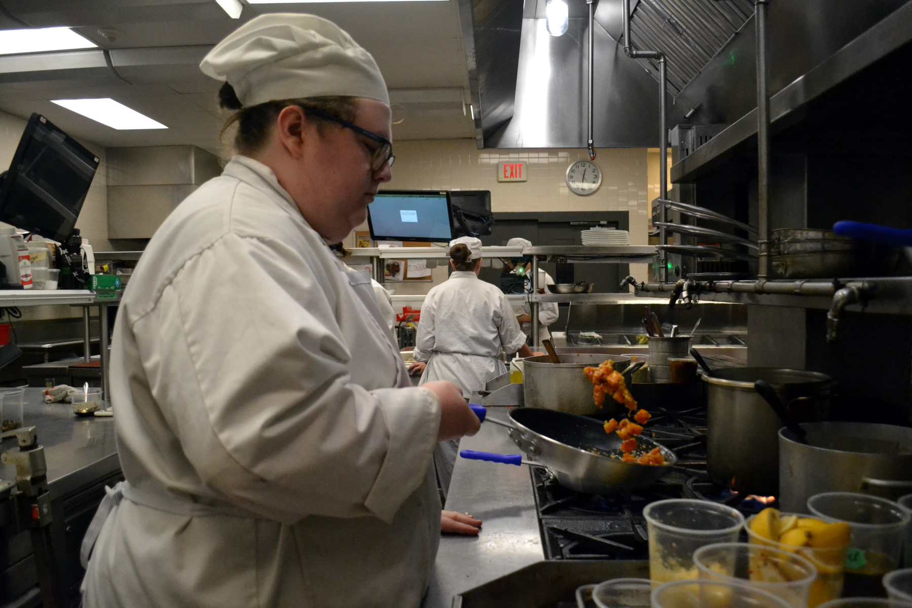 Student cooking pasta in Culinary Lab
