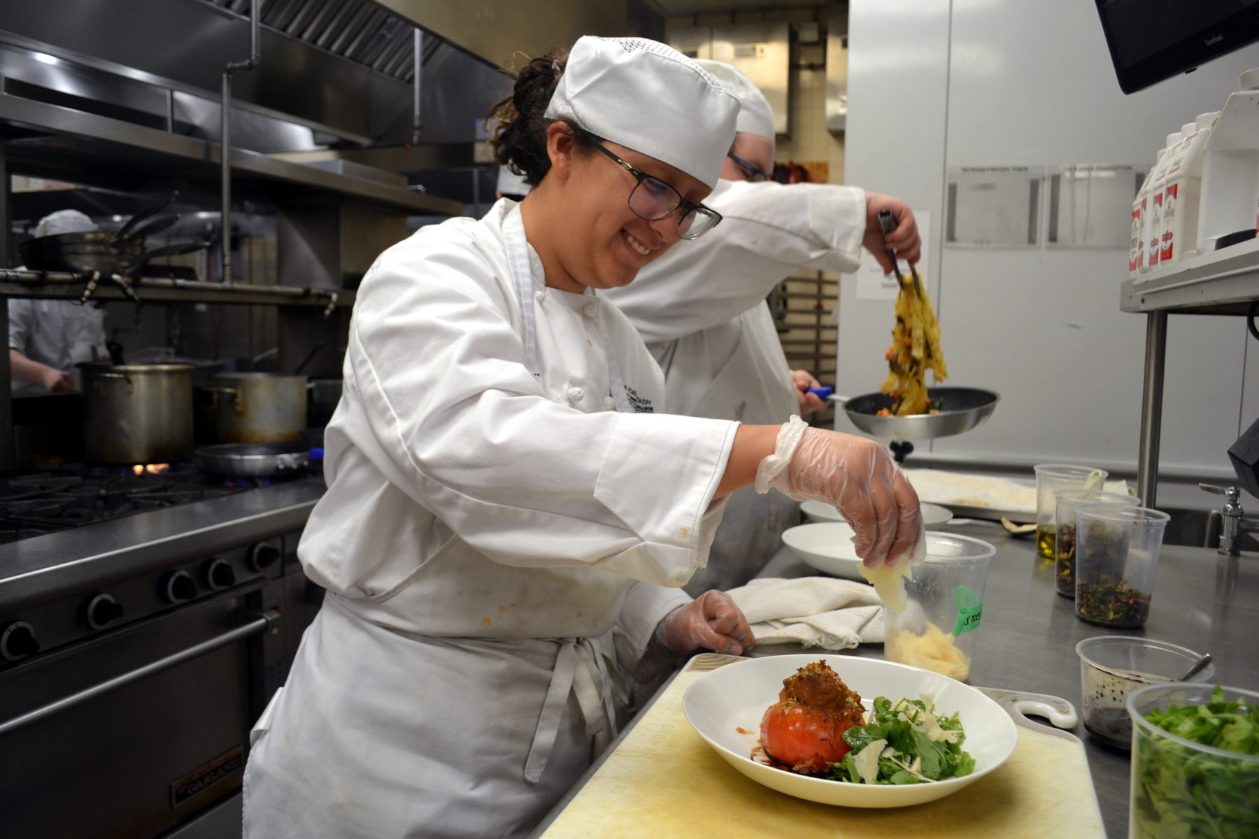 Student in Culinary Art making food for Casola Dining Room