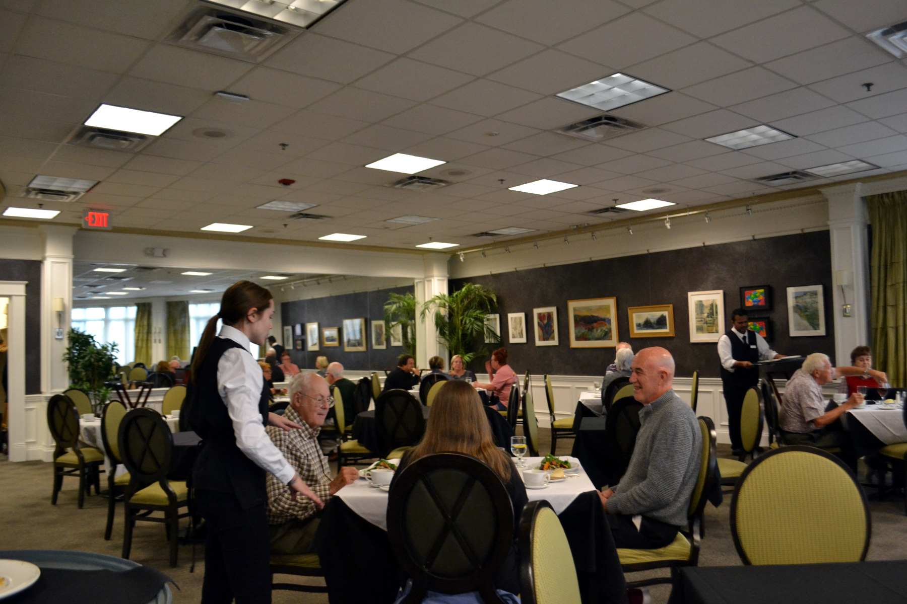 Guests seated and dining in Casola Dining Room