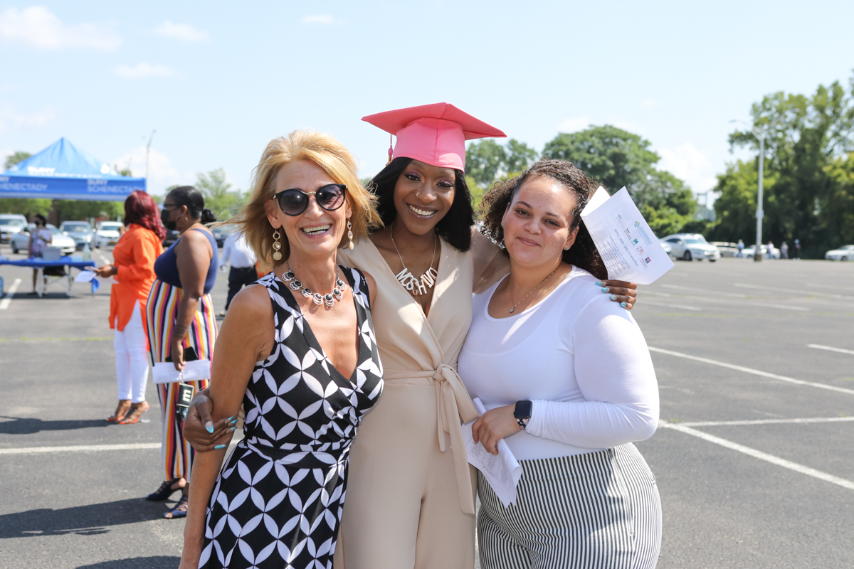 Healthcare grad with family outside