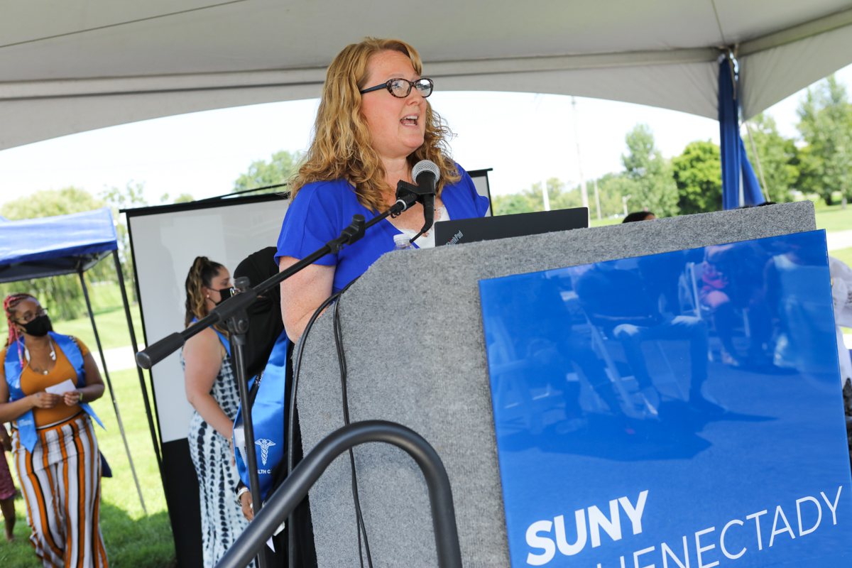 Sarah Wilson Sparrow speaking at podium on stage