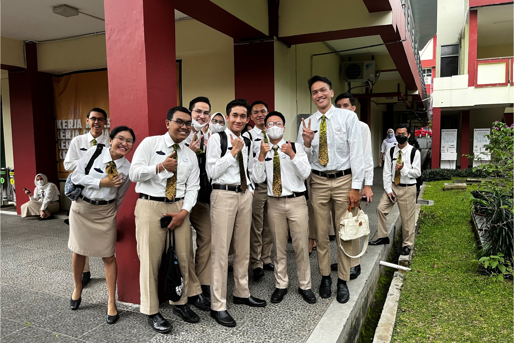 Students standing outside school in Indonesia.