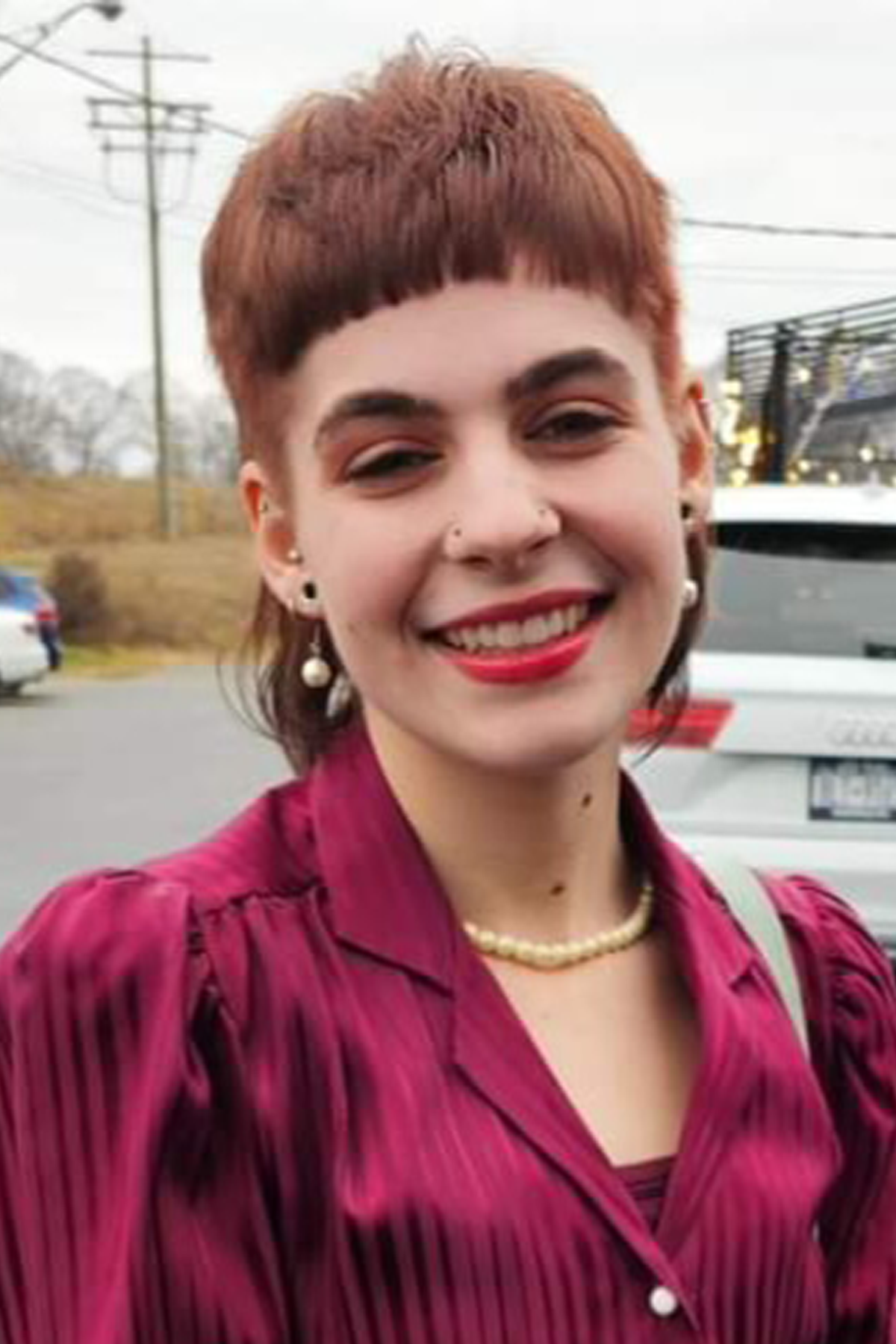 Isabella Kreitner standing outside, smiling at camera