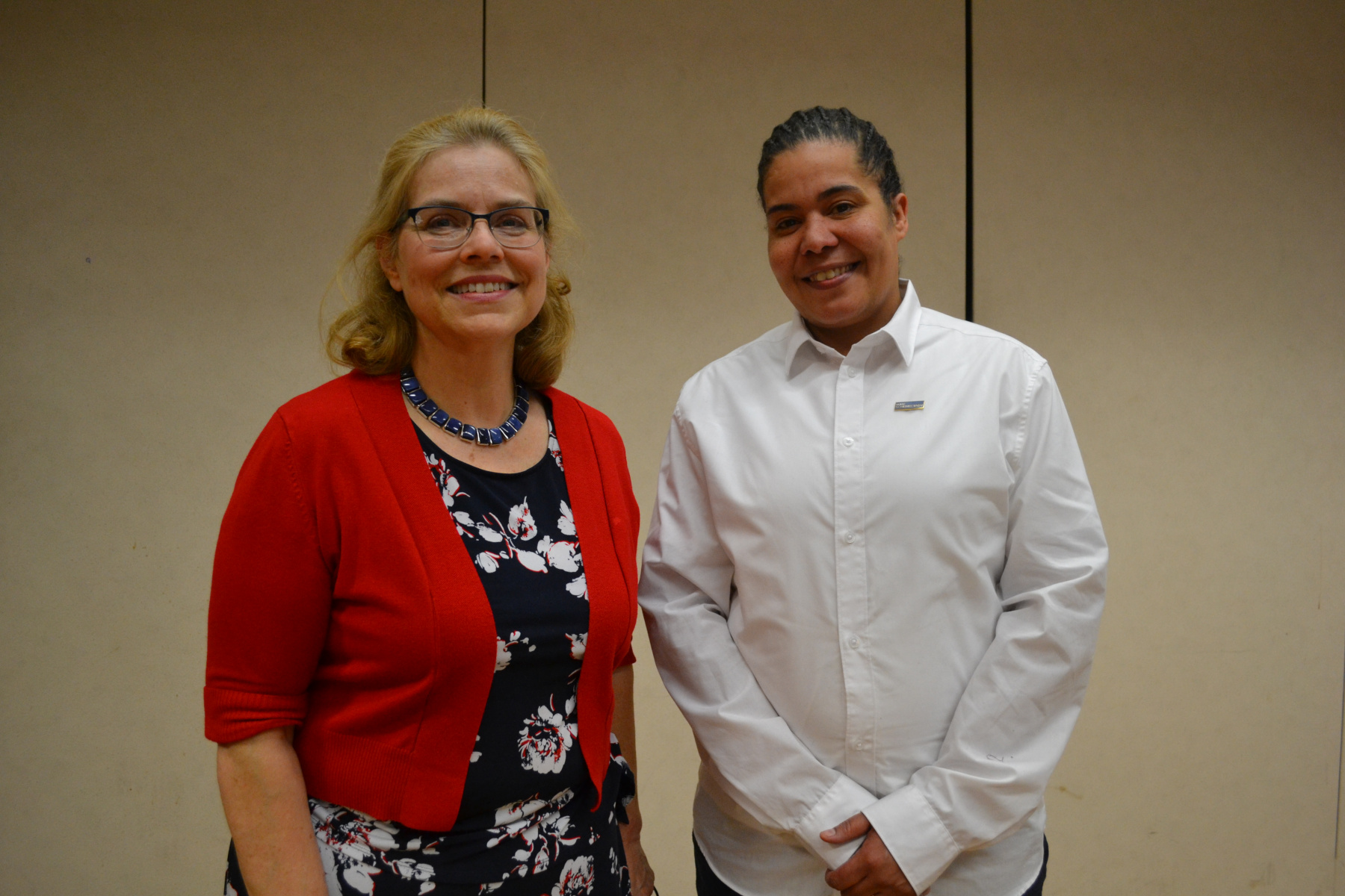 Jennifer Malave and Ann Fleming Brown standing in Van Curler Room during Trustees meeting