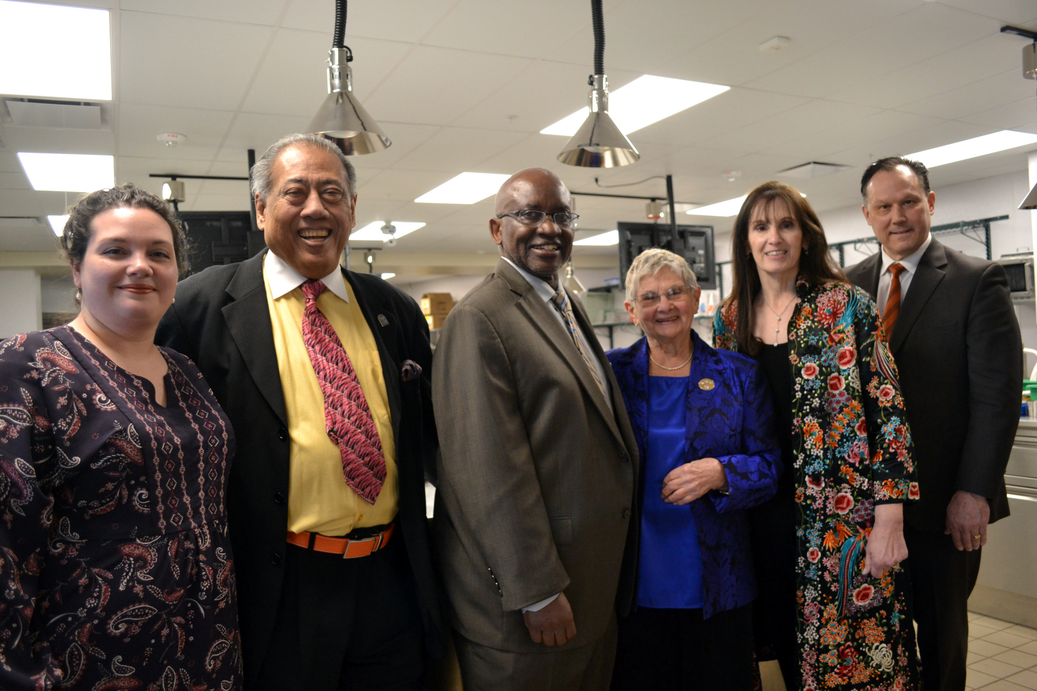 Joan and College officials inside lab