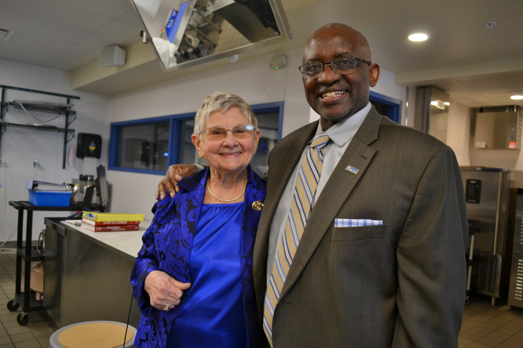 Joan Dembinski and Dr. Steady Moono standing inside lab