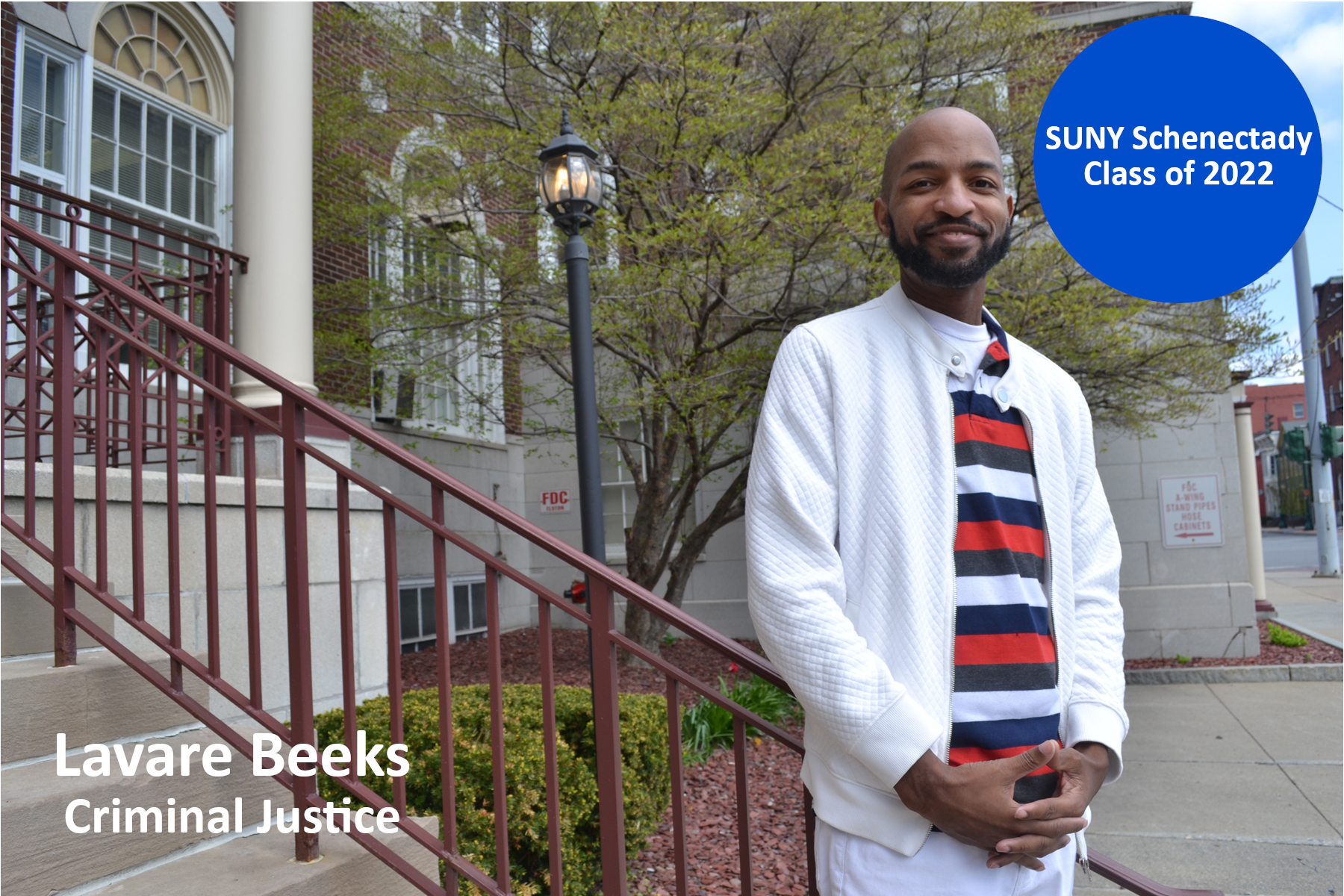 Lavare Beeks standing on the front steps of Elston Hall