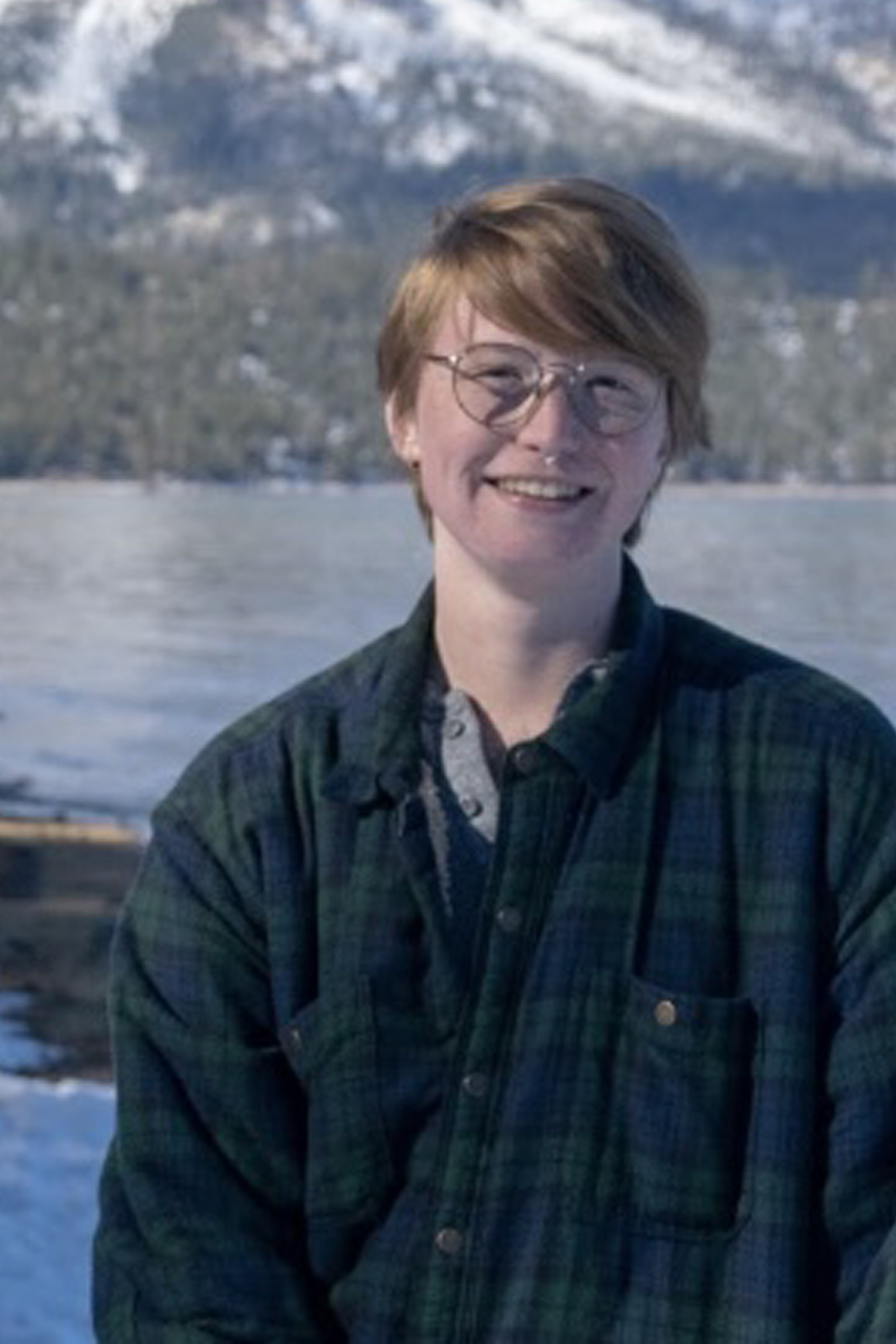 Lawrence Hazel Mullen smiling outside, mountains in the background