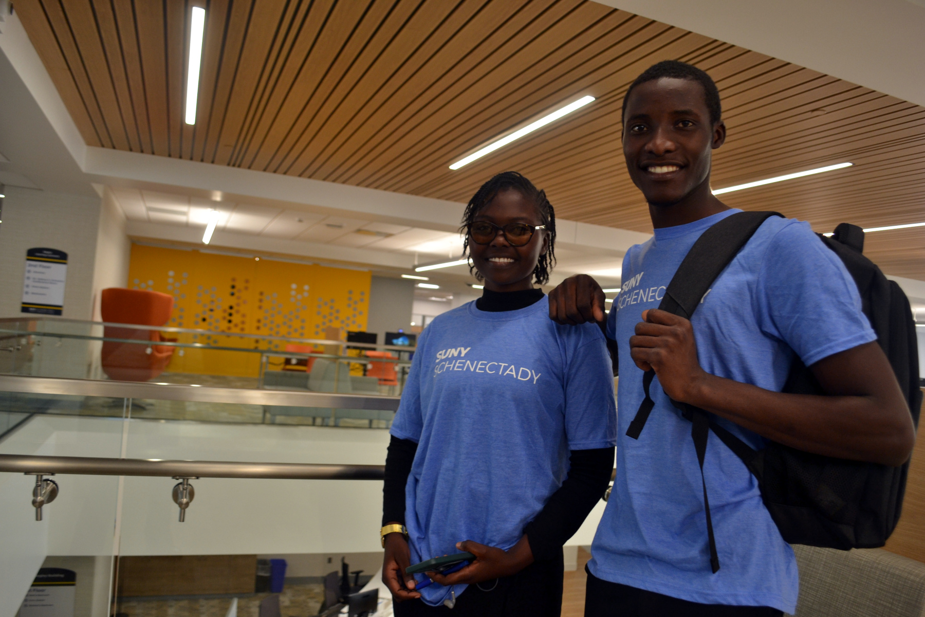 Maureen Mbanga and Ngambela Zulu standing upstairs in the Learning Commons