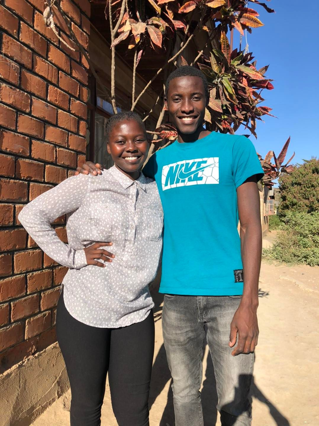 Maureen Mbanga and Ngambela Zulu standing outside in Zambia