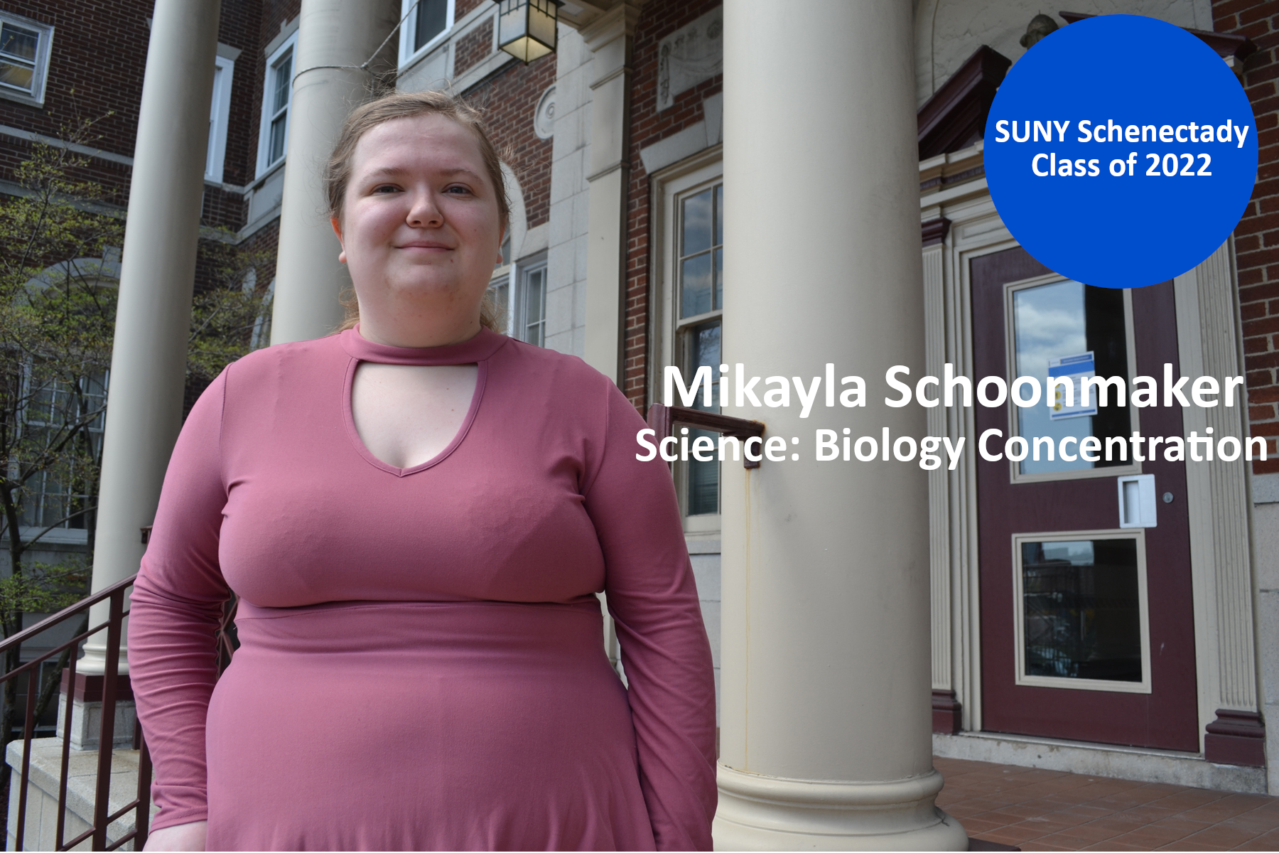 Mikayla Schoonmaker standing on the front steps of Elston Hall