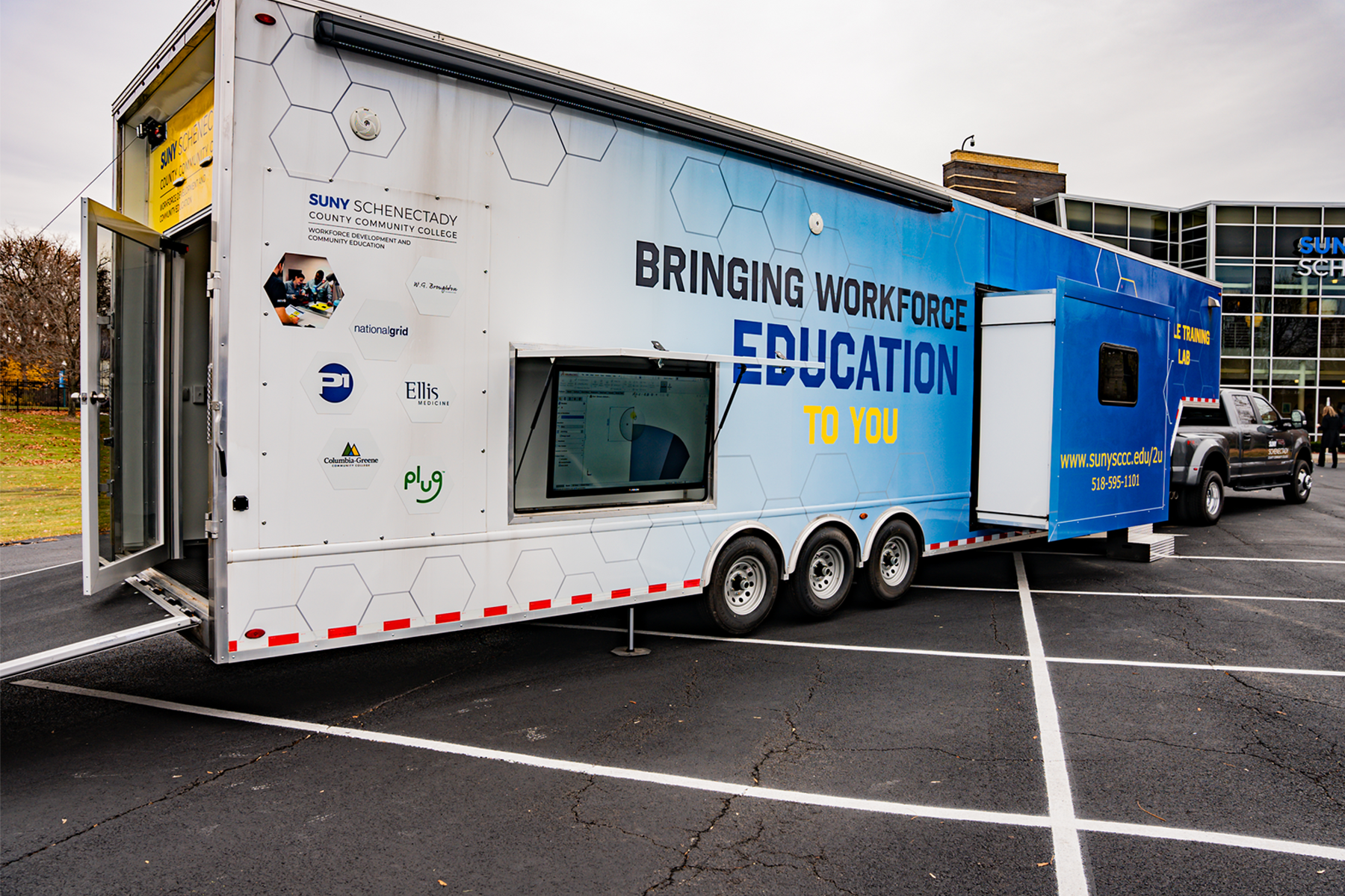 Mobile Training Lab and truck parked in School of Music parking area