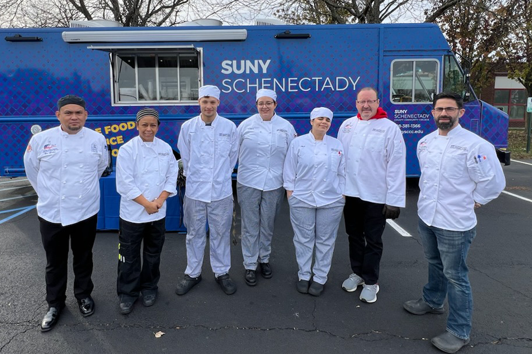 Chefs in front of College Food Truck
