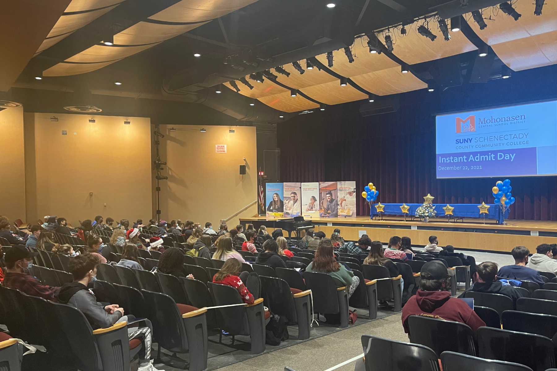 Students sitting in Mohonasen H.S. auditorium during assembly.