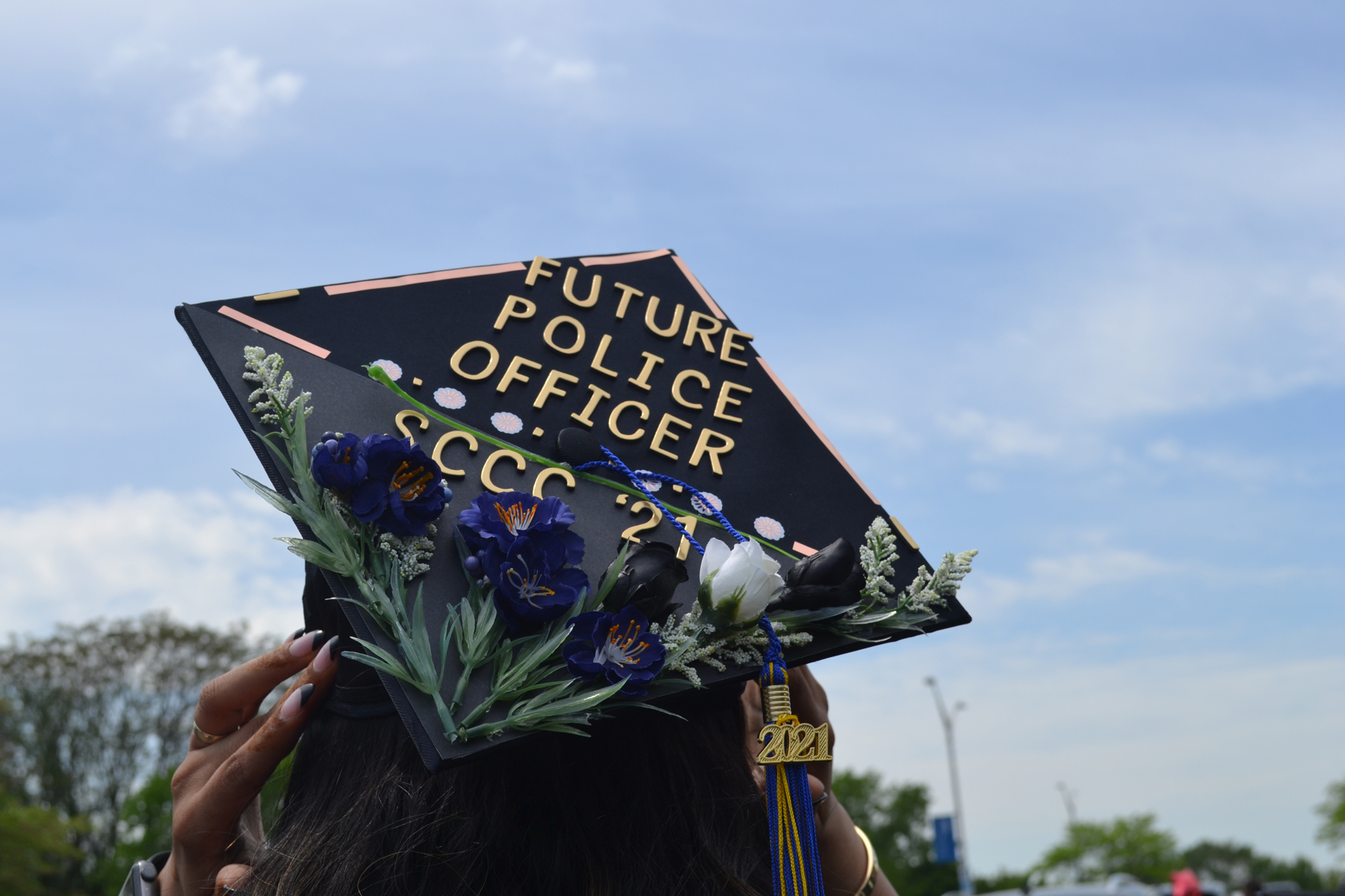 Mortarboard reading, future police officer