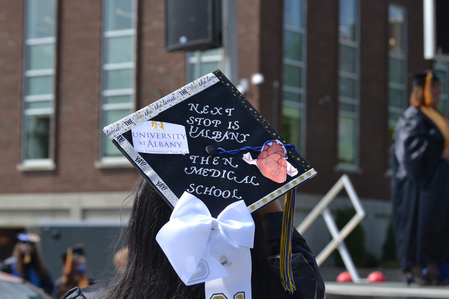 Graduate's mortarboard reading that she is going to medical school next. 