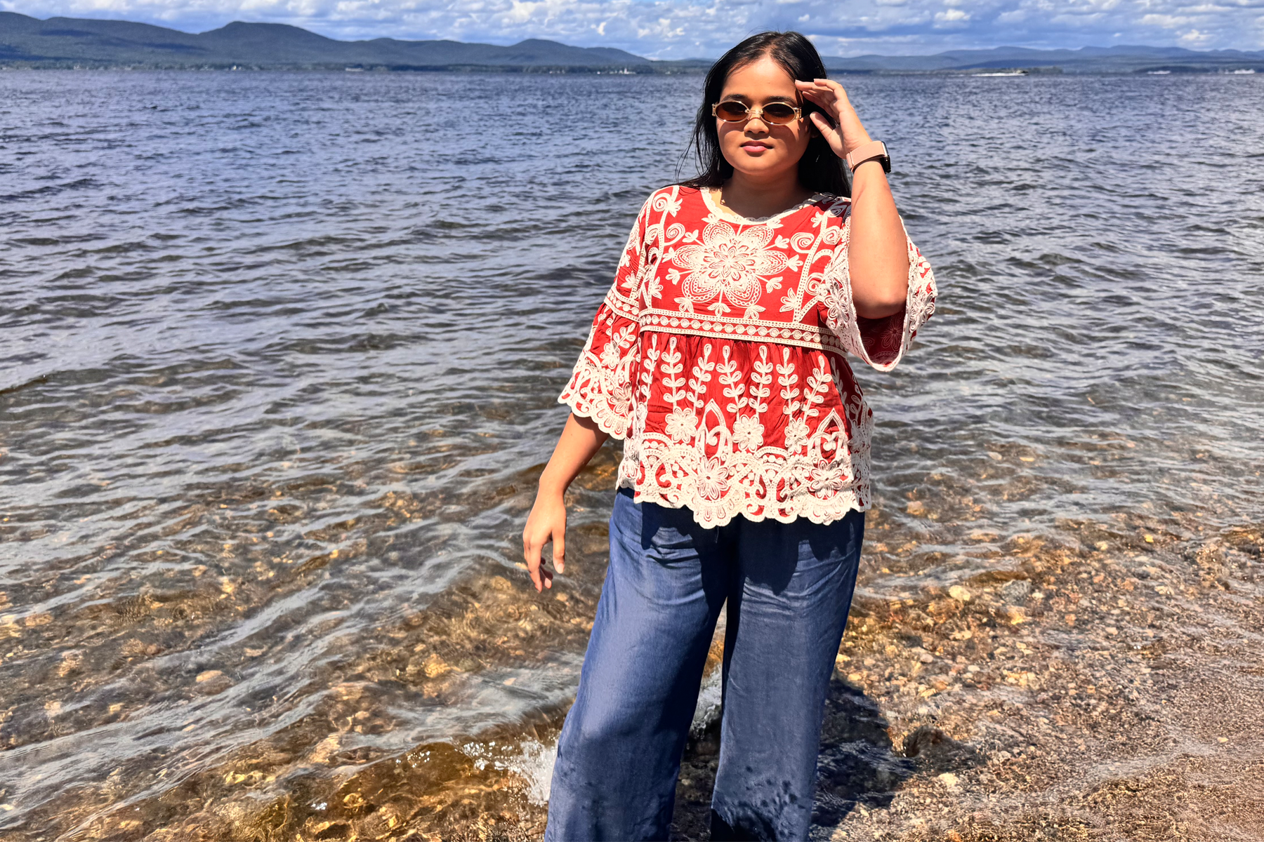 Mubashra Warriach standing in water on beach