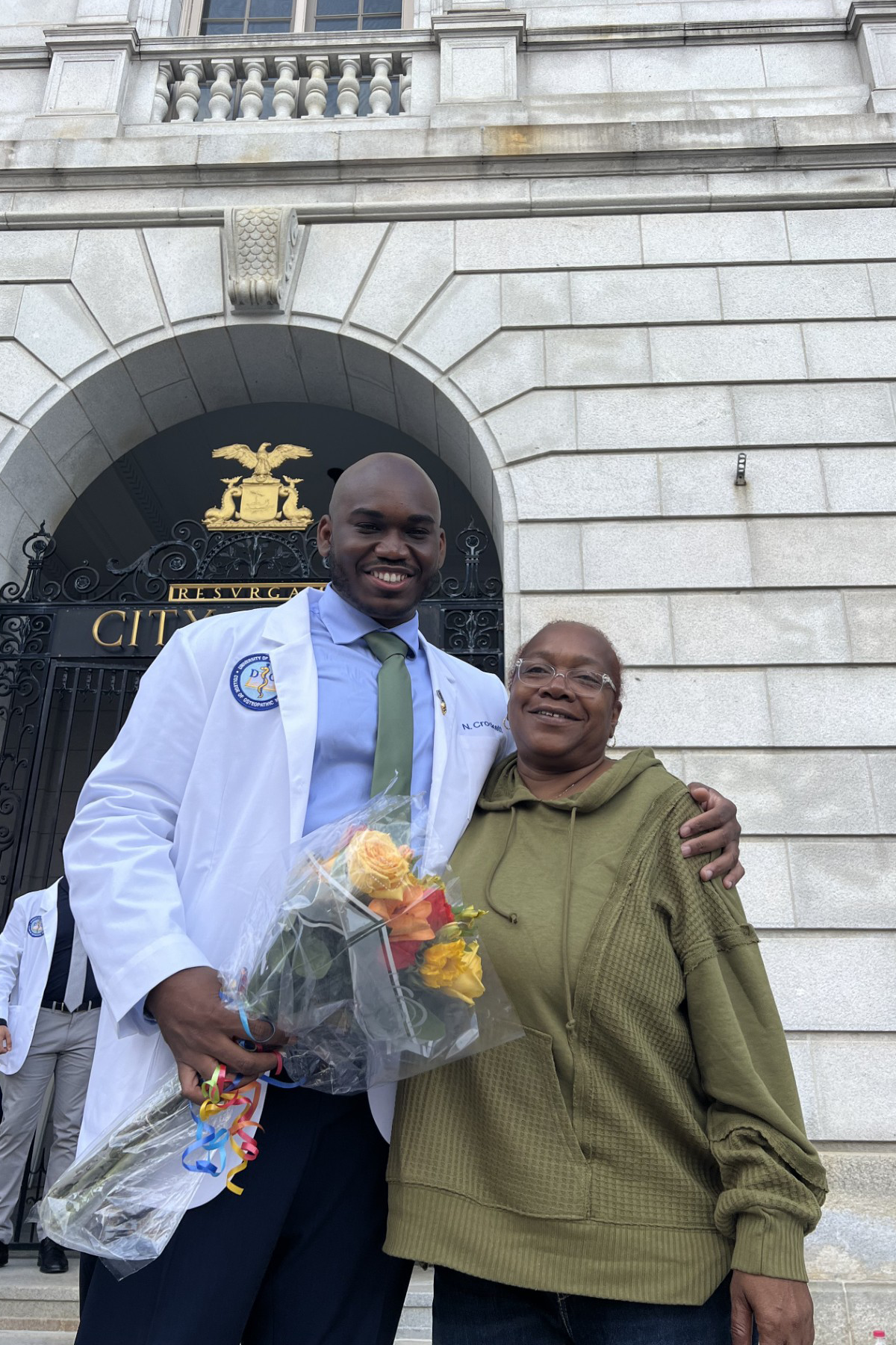 Nieem Crockett standing outside with his Mother Firlina