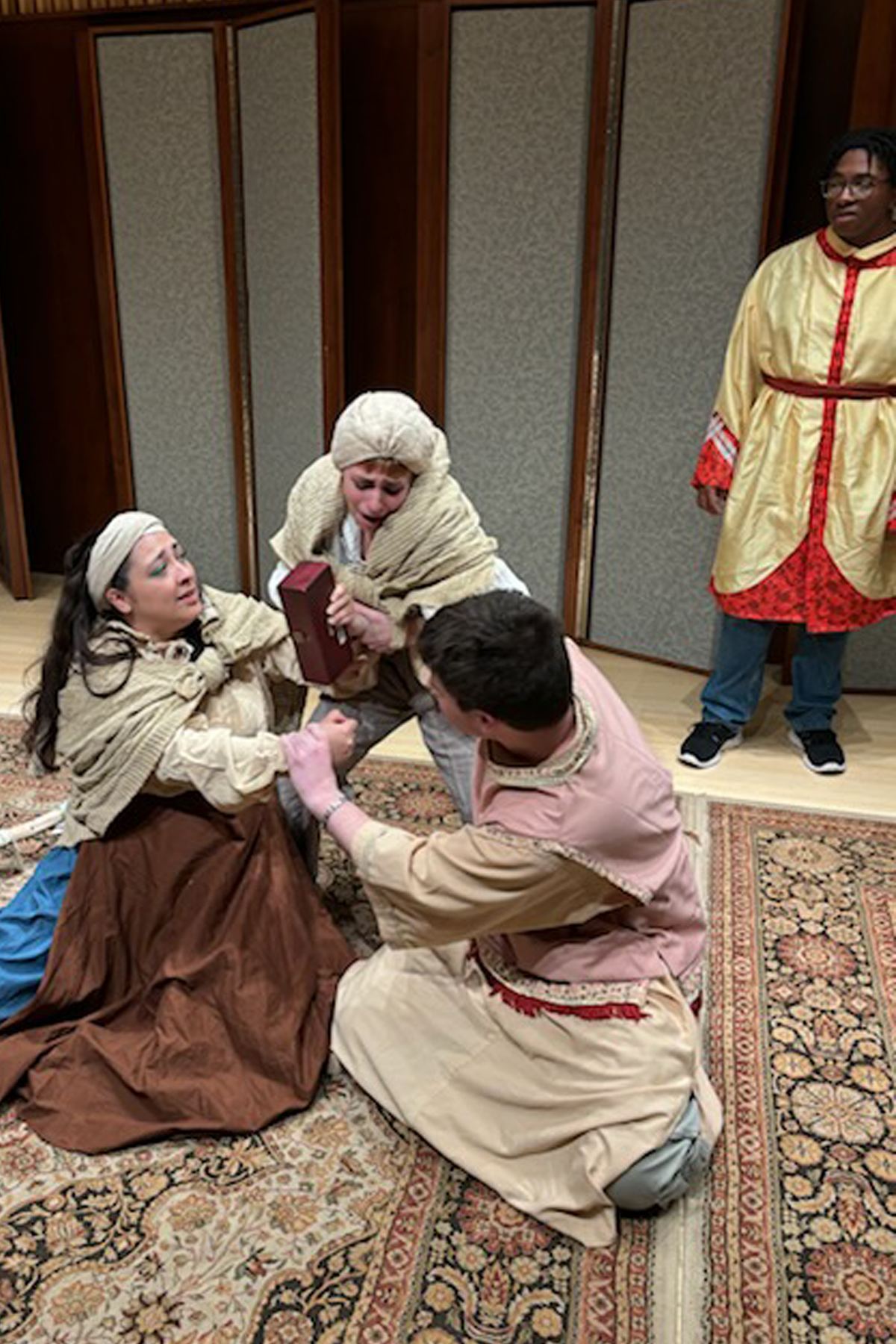 Students in costume rehearsing