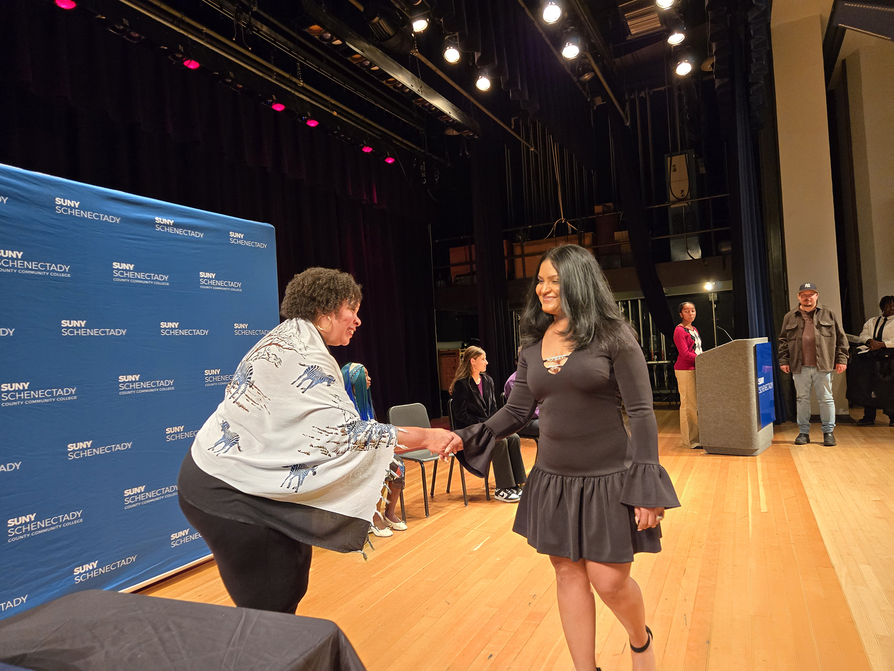 Student crossing the stage