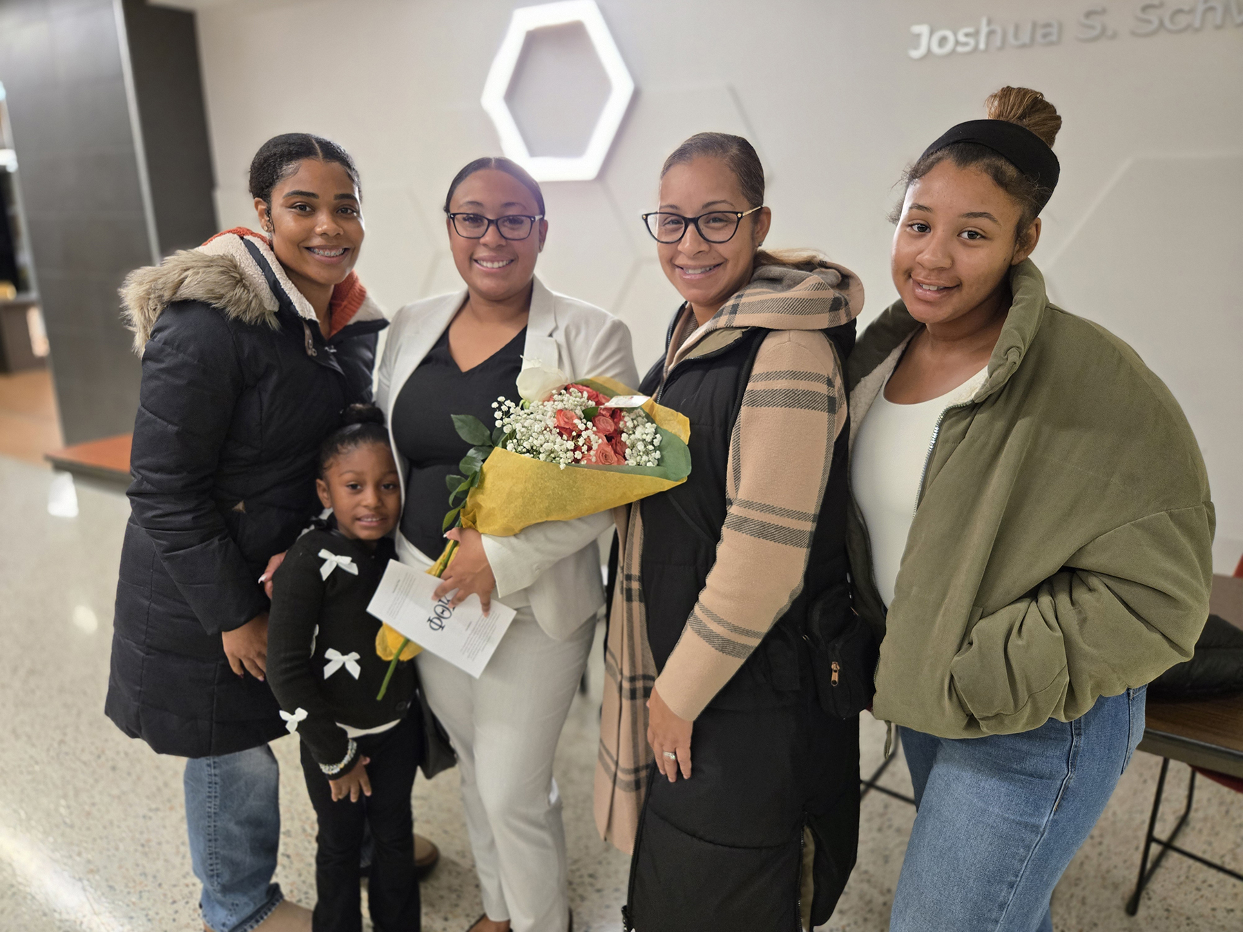 Student and family members standing in lobby