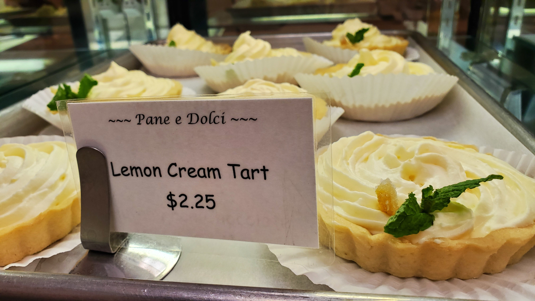 Lemon tart in bakery case