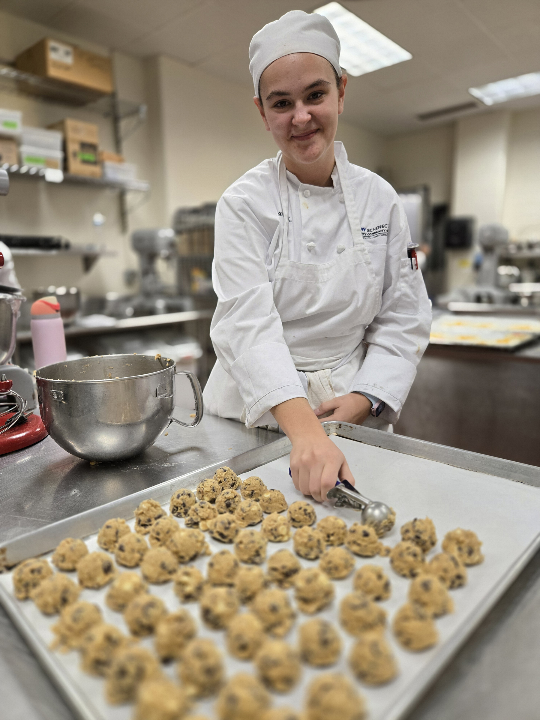Student making cookies in kitchen
