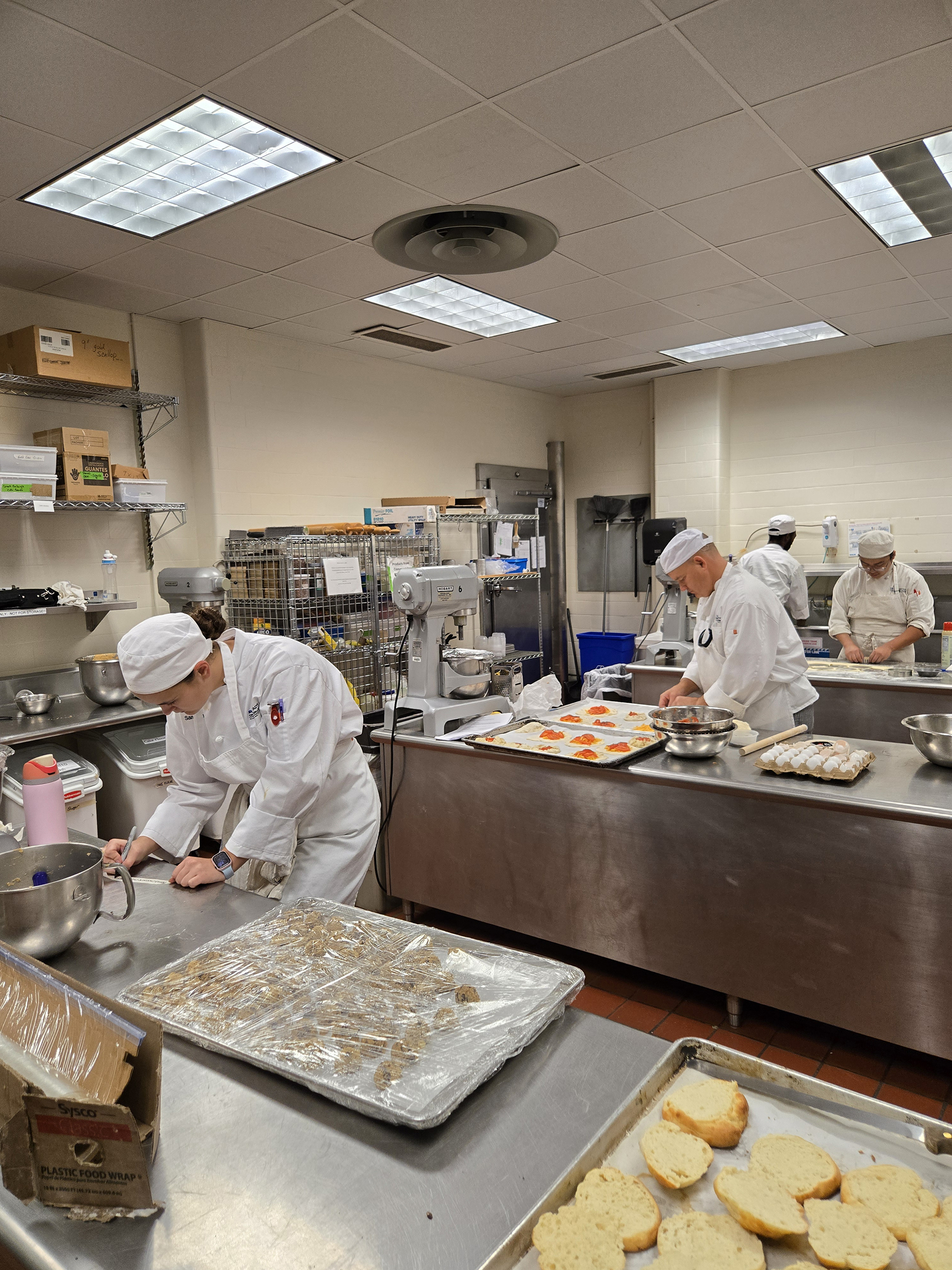 Students baking in kitchen
