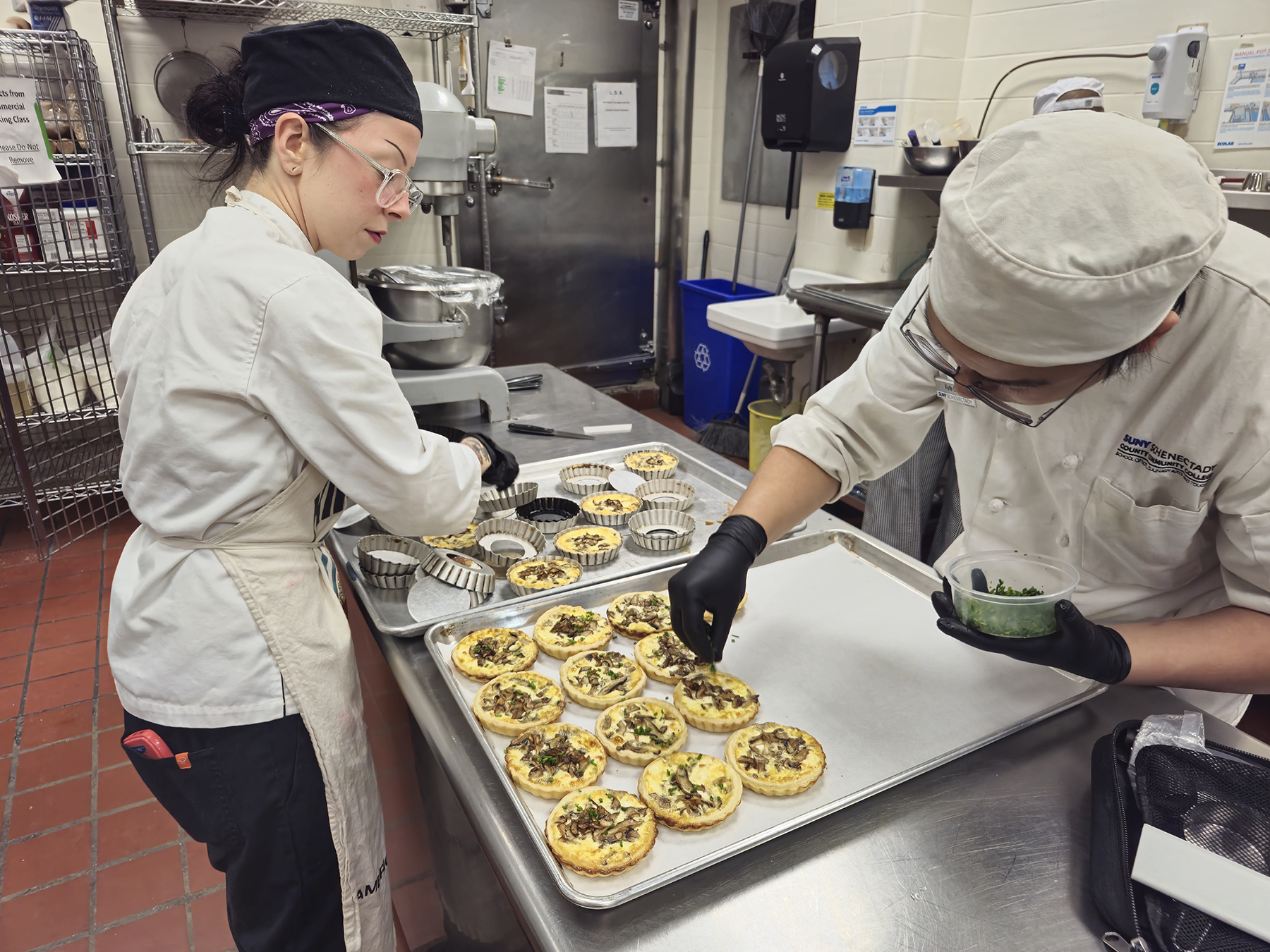 Faculty chef and student chef preparing quiche