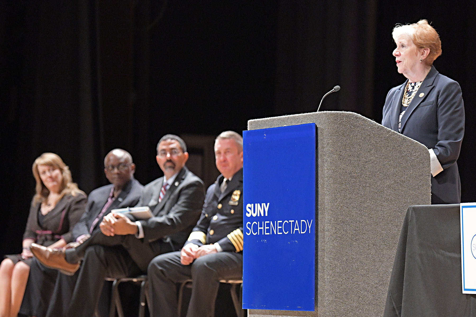 Commissioner Roberta Reardon, New York State Department of Labor, speaking at podium in auditorium