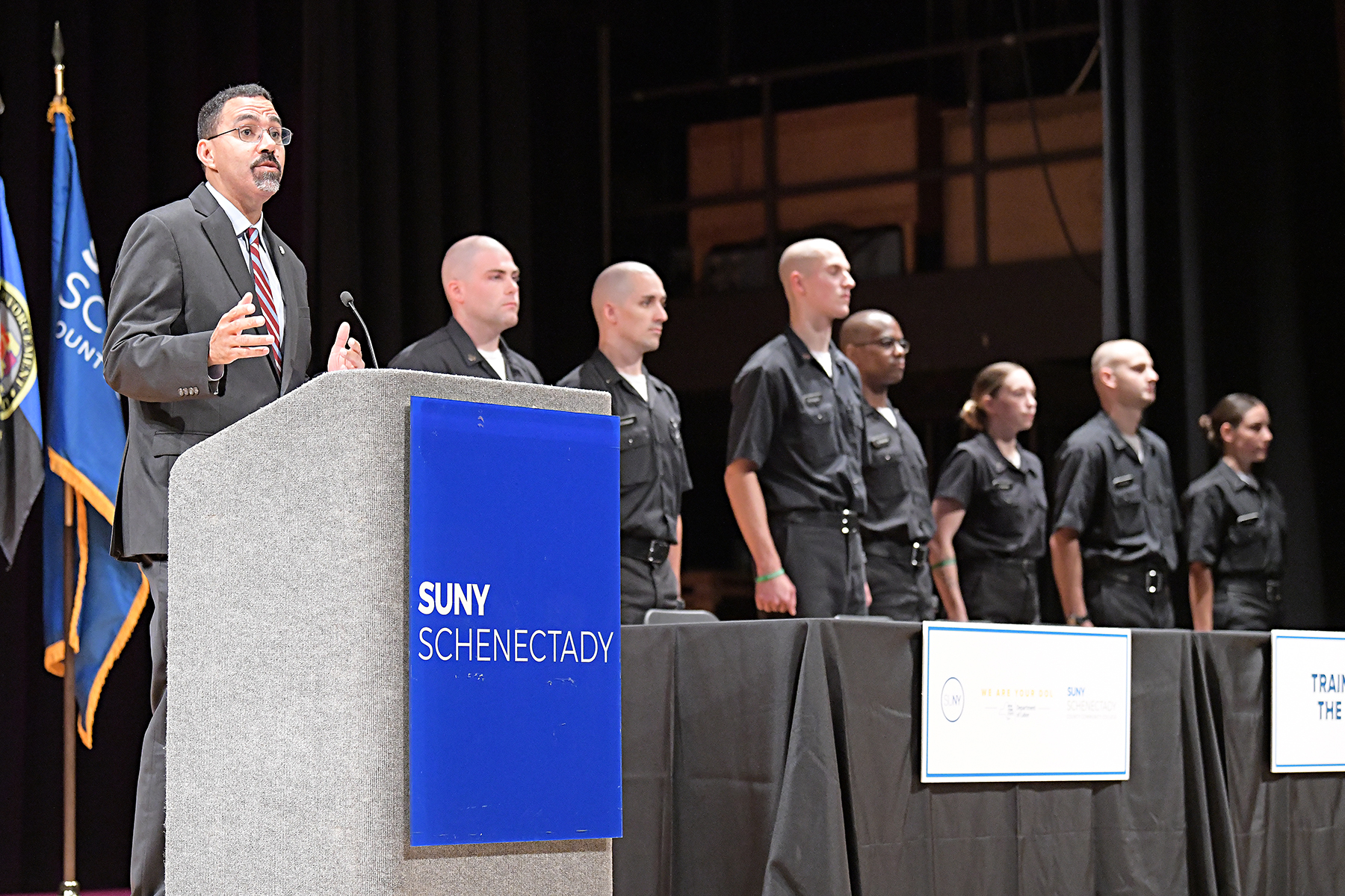 SUNY Chancellor John B. King Jr. speaking at podium