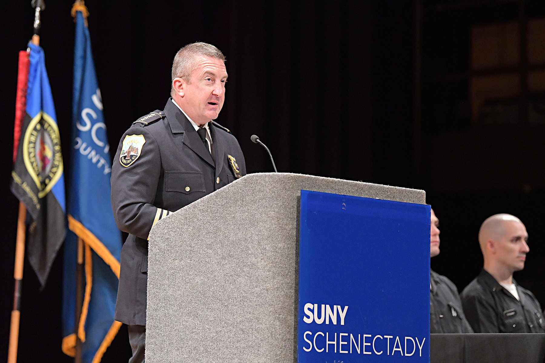 Schenectady Police Chief Clifford speaking at podium