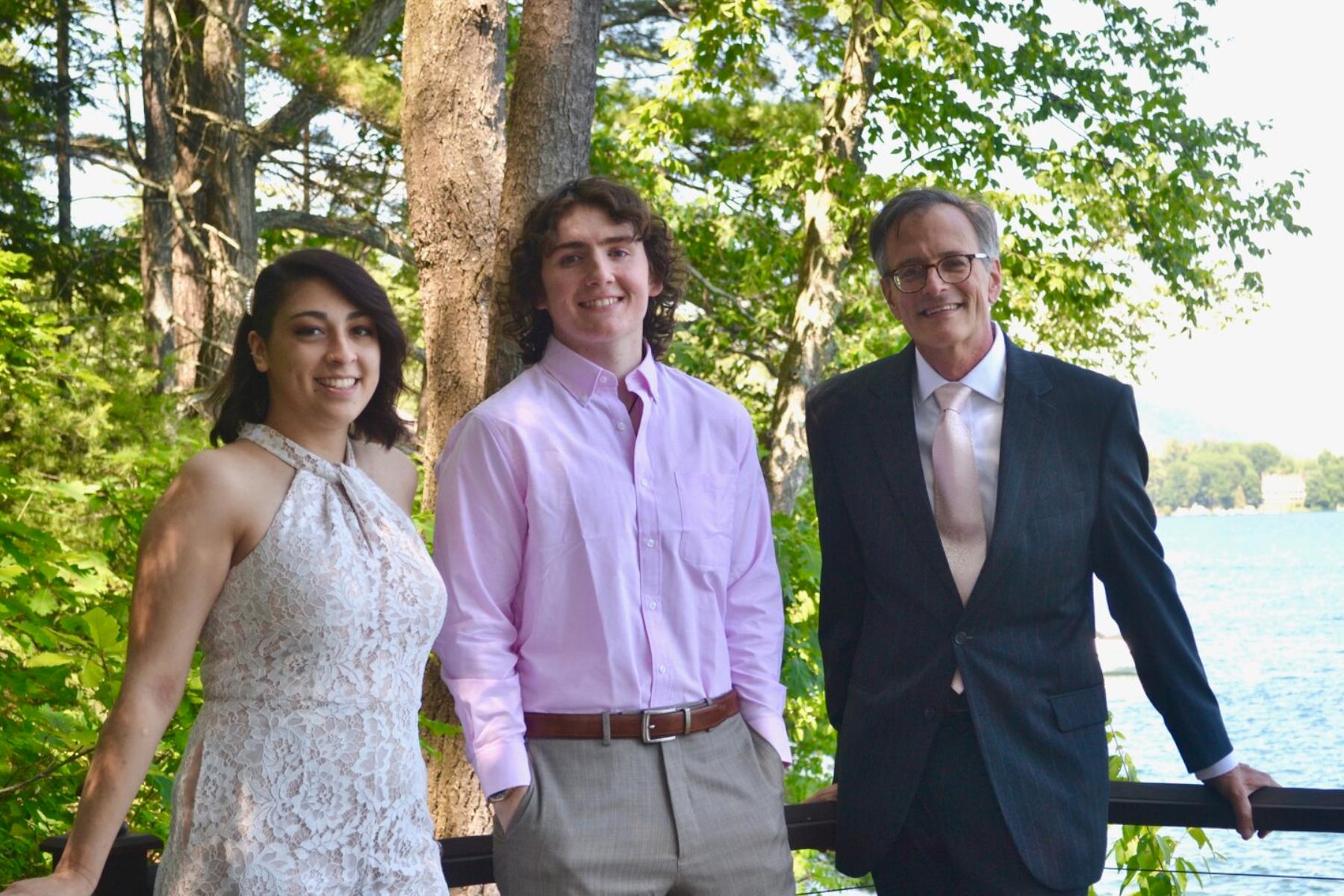 Areli Mendoza-Pannone, Robert Frazier, and Mark Evans standing outside with lake behind them