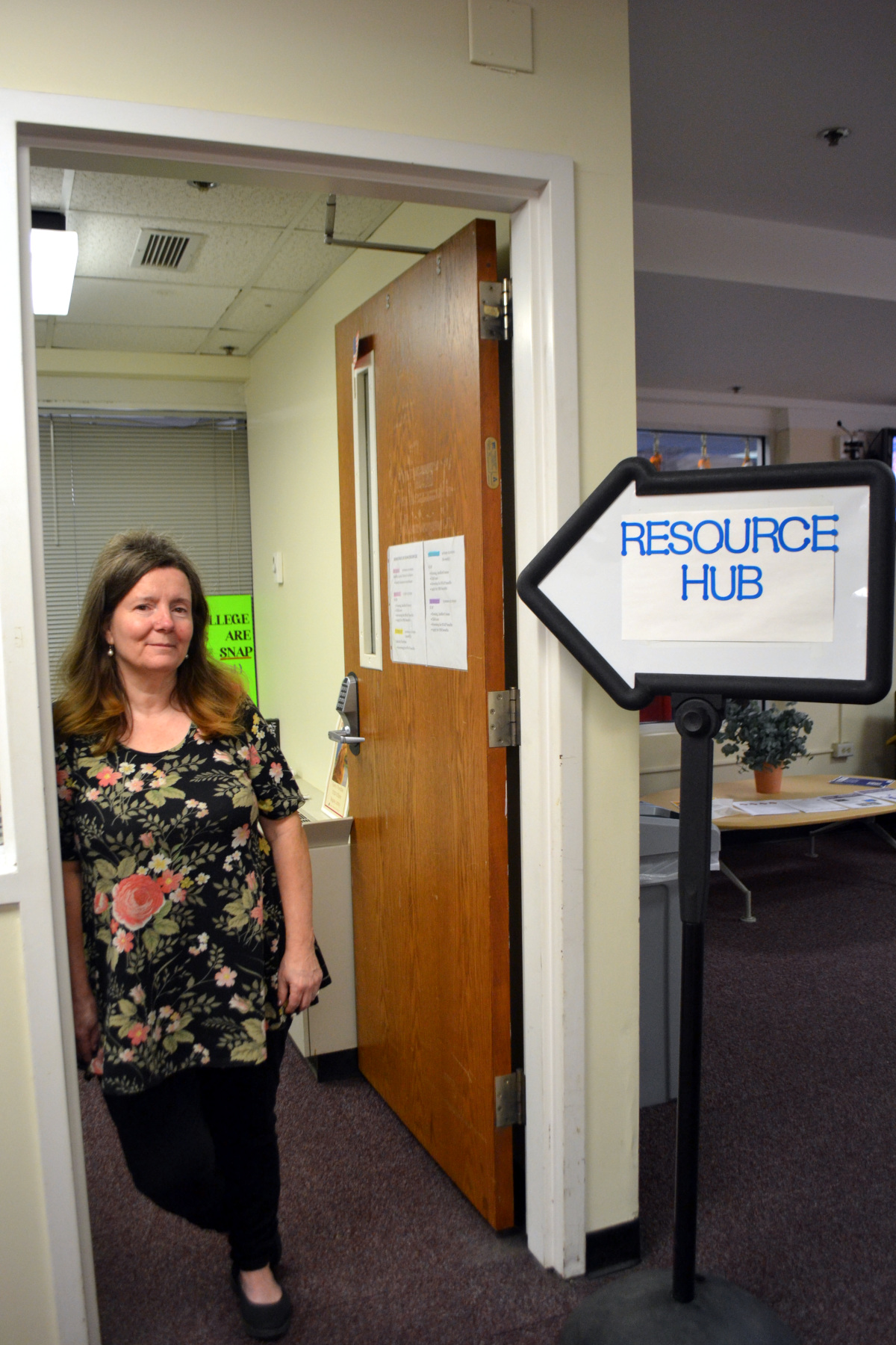 Robyn King standing in front of Resource Hub, Elston Hall, Second floor