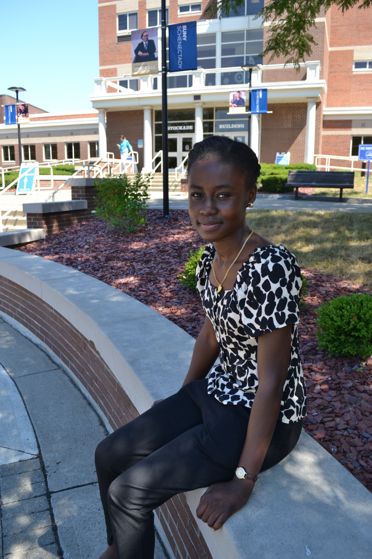 Rondacia McPherson sitting outside on quad