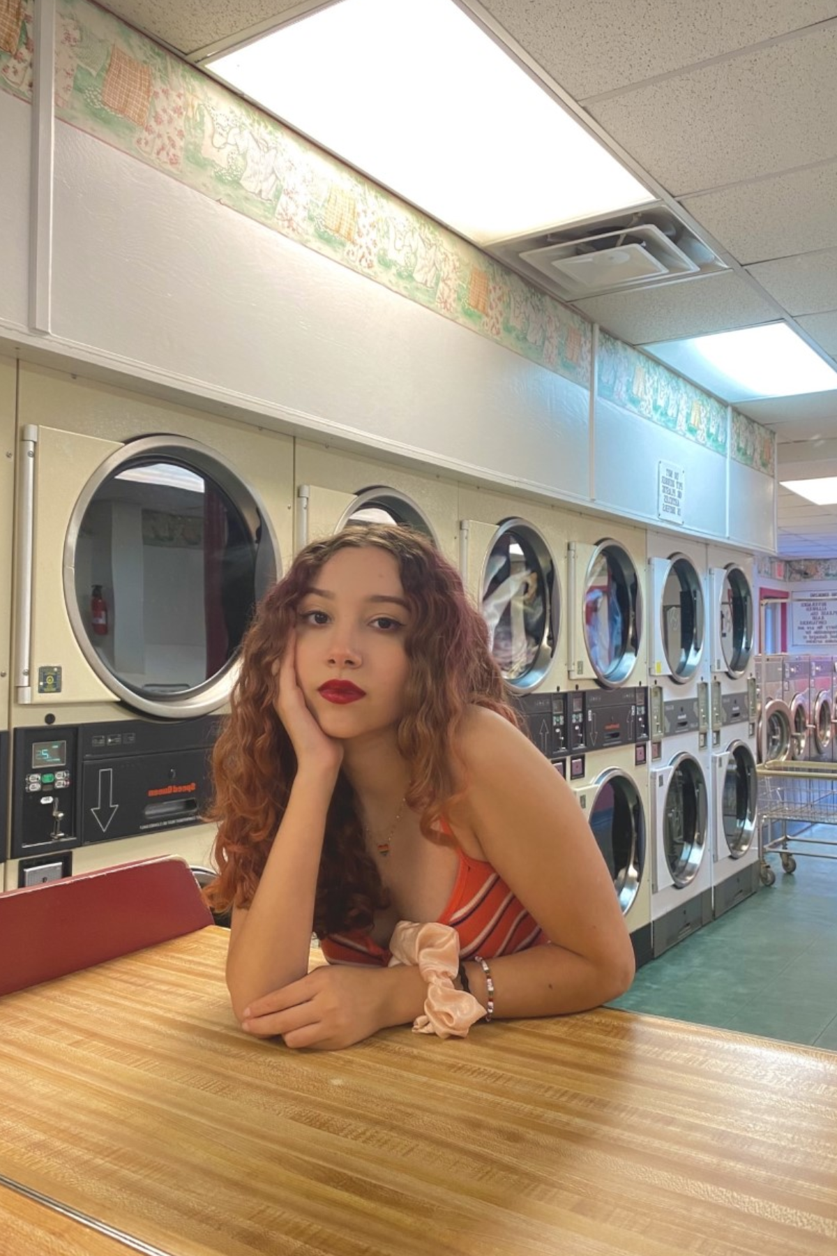 Sara Nava sitting in laundromat