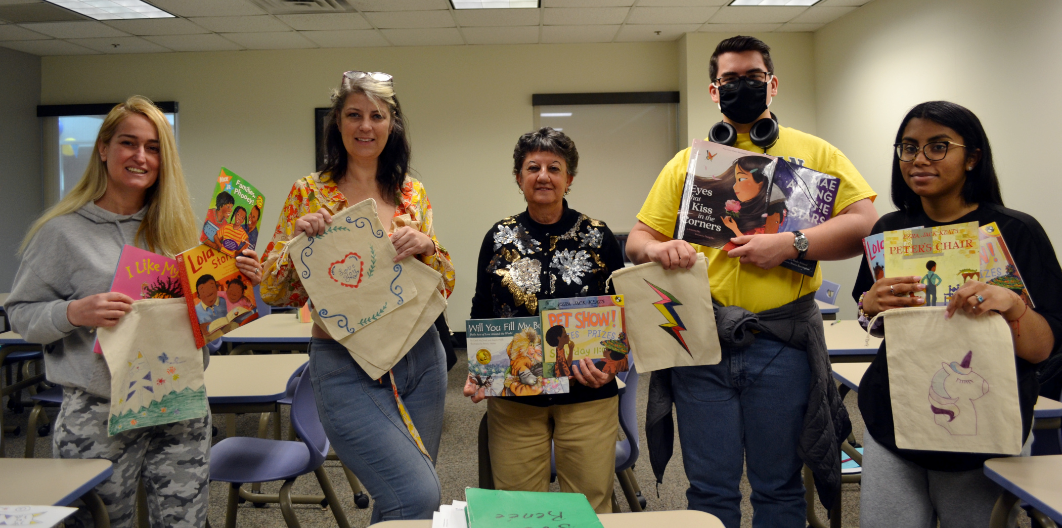 SVO Club holding books in classroom