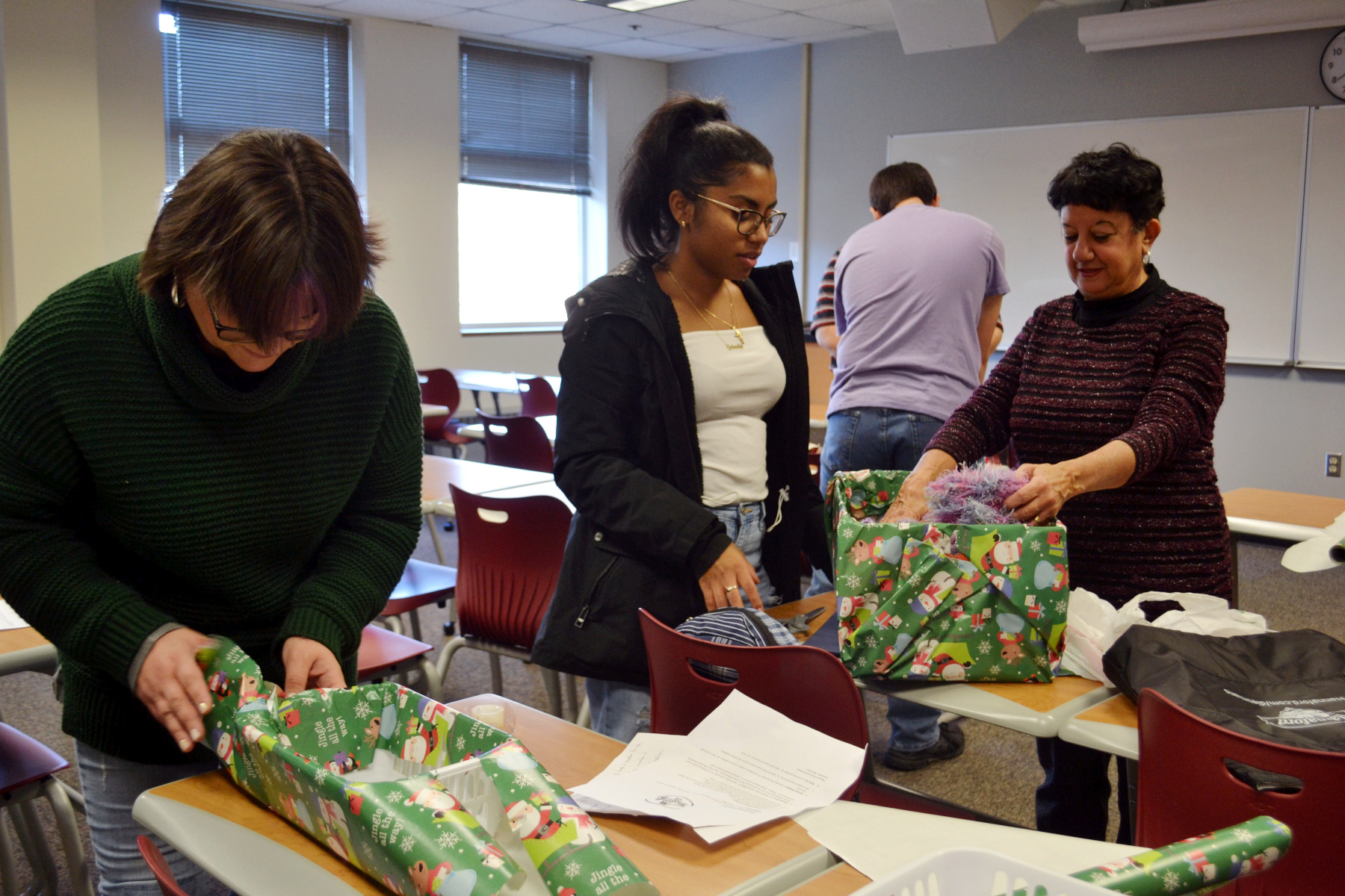 SVO members wrapping holiday giveaways