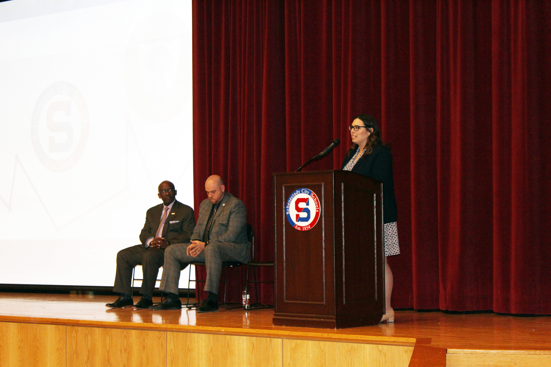 Laura Sprague speaking in Schenectady High School auditorium