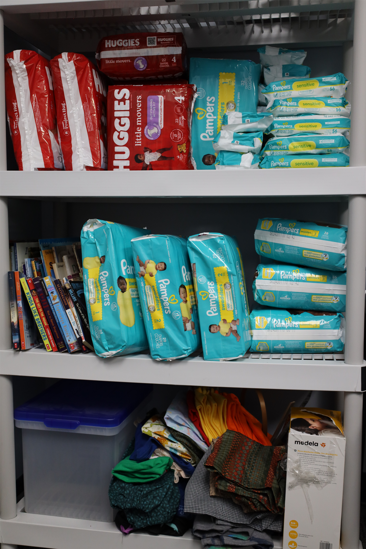 Boxes of baby diapers and other items on shelves in Wildwood Cupboard Food Pantry