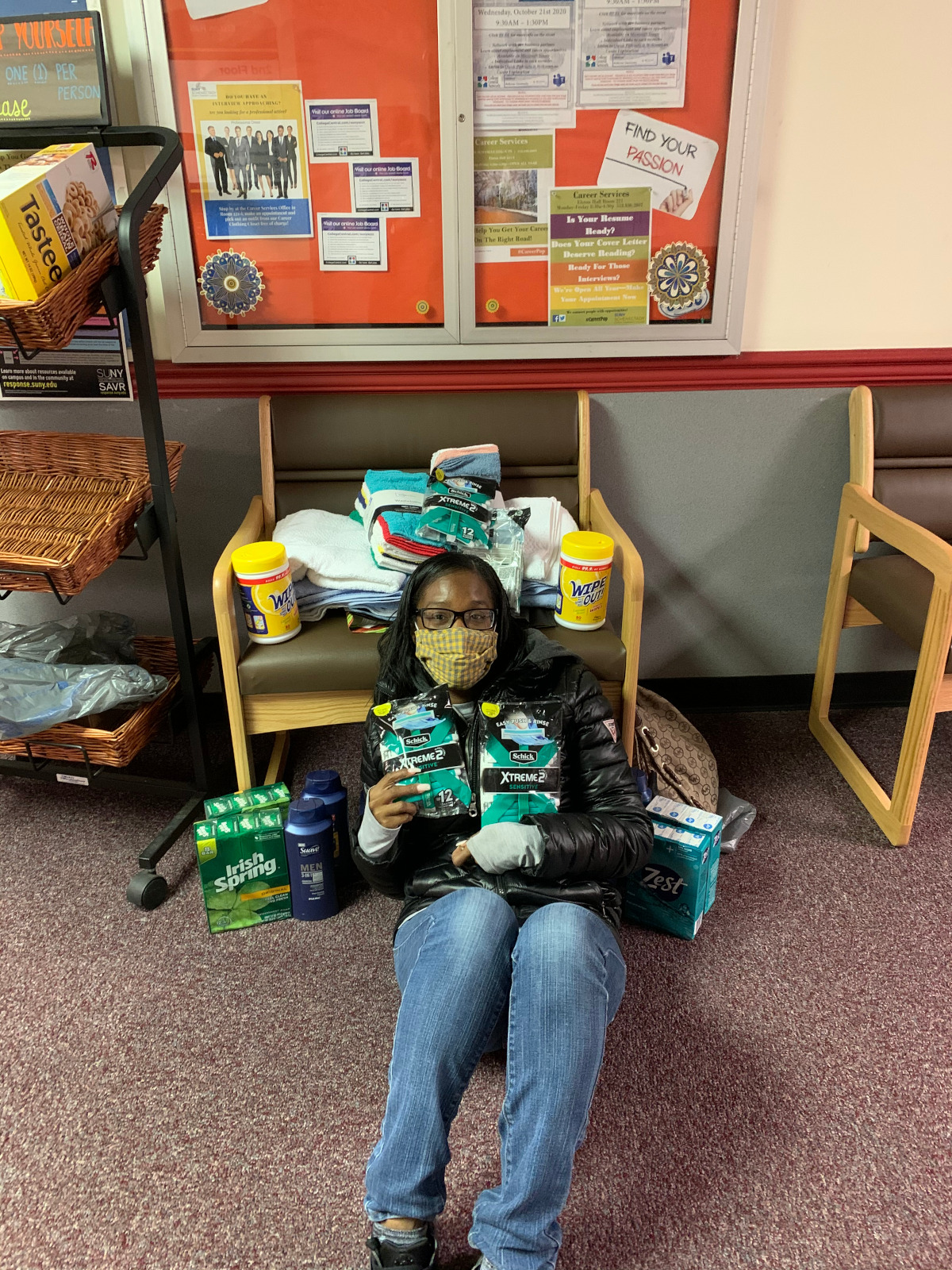 Shaniqua Pierce with some of the items her group collected for local non-proft agencies.