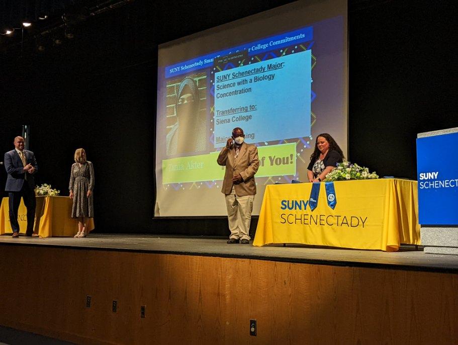 Dr. Moono, Pam McCall and others on stage during ceremony